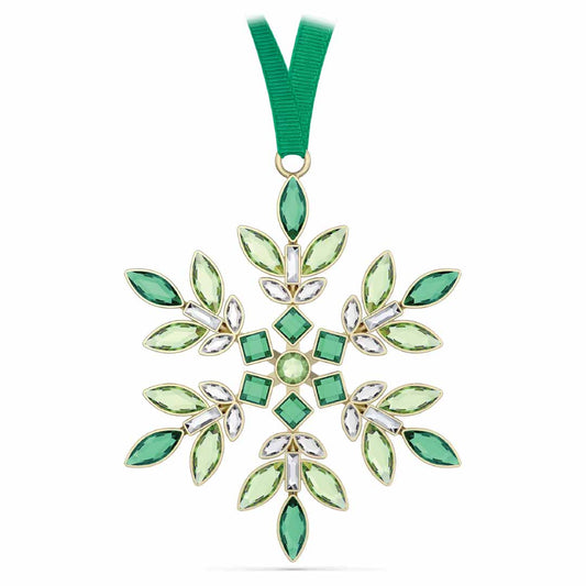 The Swarovski Gema Holiday Ornament Home Décor piece, from the renowned brand Swarovski, is embellished with green and clear gemstones, crafting a stunning holiday decoration. Suspended from a green ribbon, it gleams with the radiant brilliance of Swarovski crystals arranged in an impeccably symmetrical pattern.