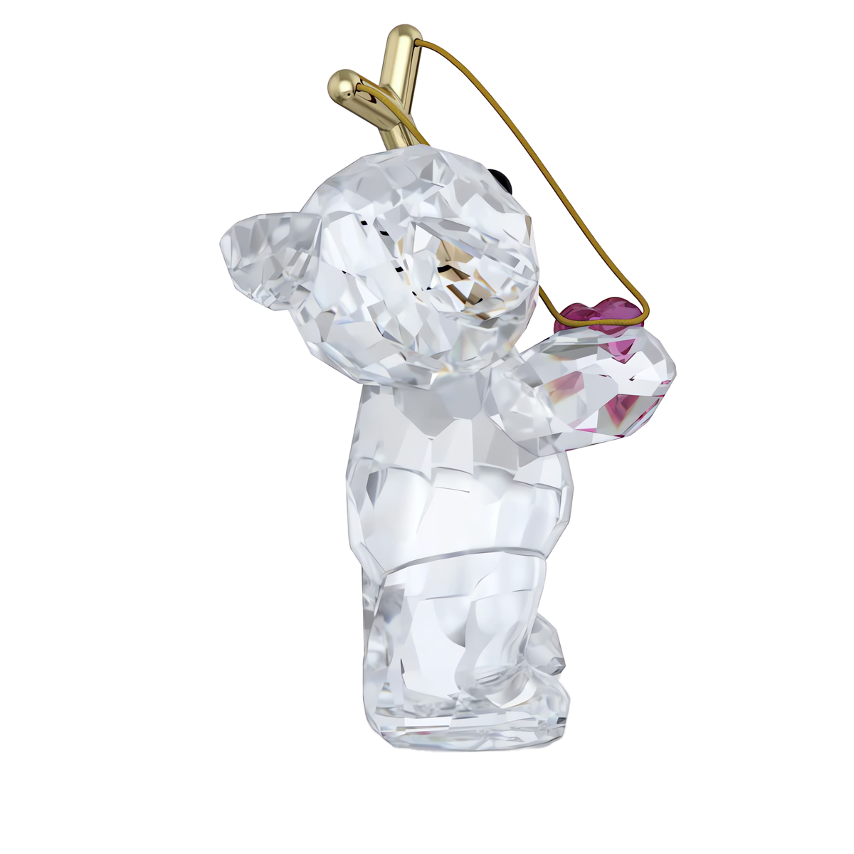Swarovski’s Kris Bear Sending you Love figurine, featuring gold-tone antennae and holding a delicate pink crystal heart, stands upright against a plain white background—making it an adorable Valentine’s gift.