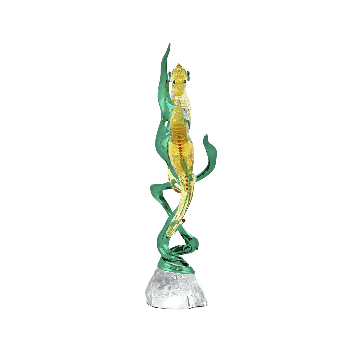 A glass sculpture from Swarovski, the Idyllia SCS Annual Edition 2025 Seahorses, features a yellow seahorse with red accents entwined by green seaweed, standing upright on a clear, textured base against a white background, showcasing exquisite elegance and expert craftsmanship.
