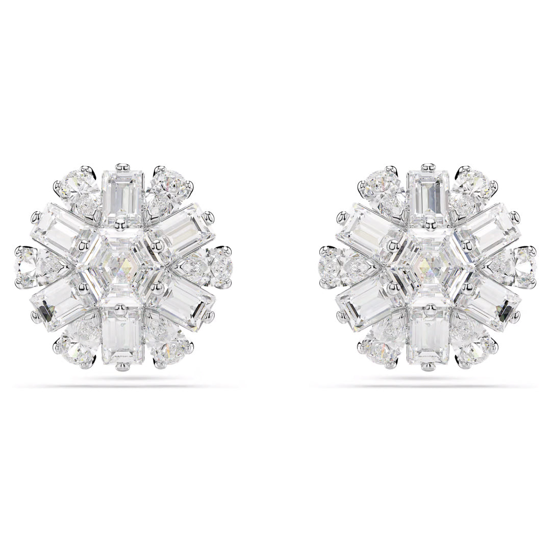 The Swarovski Idyllia Stud Earrings by Swarovski showcase rhodium-plated elegance, adorned with a stunning floral design accented with baguette and round diamonds, evoking the brilliance of snowflake-inspired stud earrings for a mesmerizing sparkle.