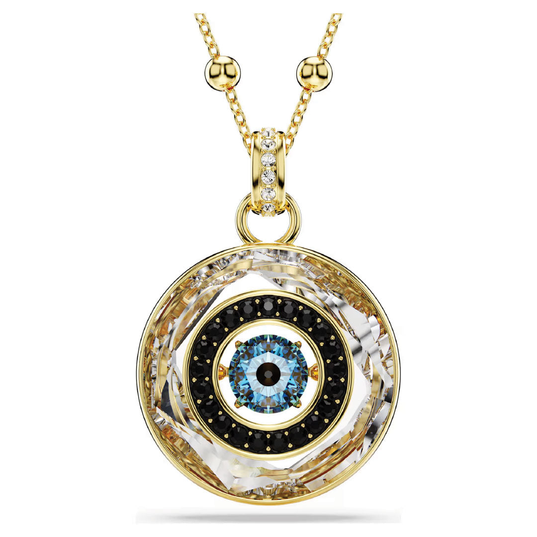 The Swarovski Symbolica Necklace Pendant showcases a gold-tone plated design with a circular pendant featuring a blue gemstone similar to an evil eye, elegantly accented in black and white. The gold chain is adorned with small decorative beads near the clasp, capturing the exquisite appeal of Swarovski jewellery.