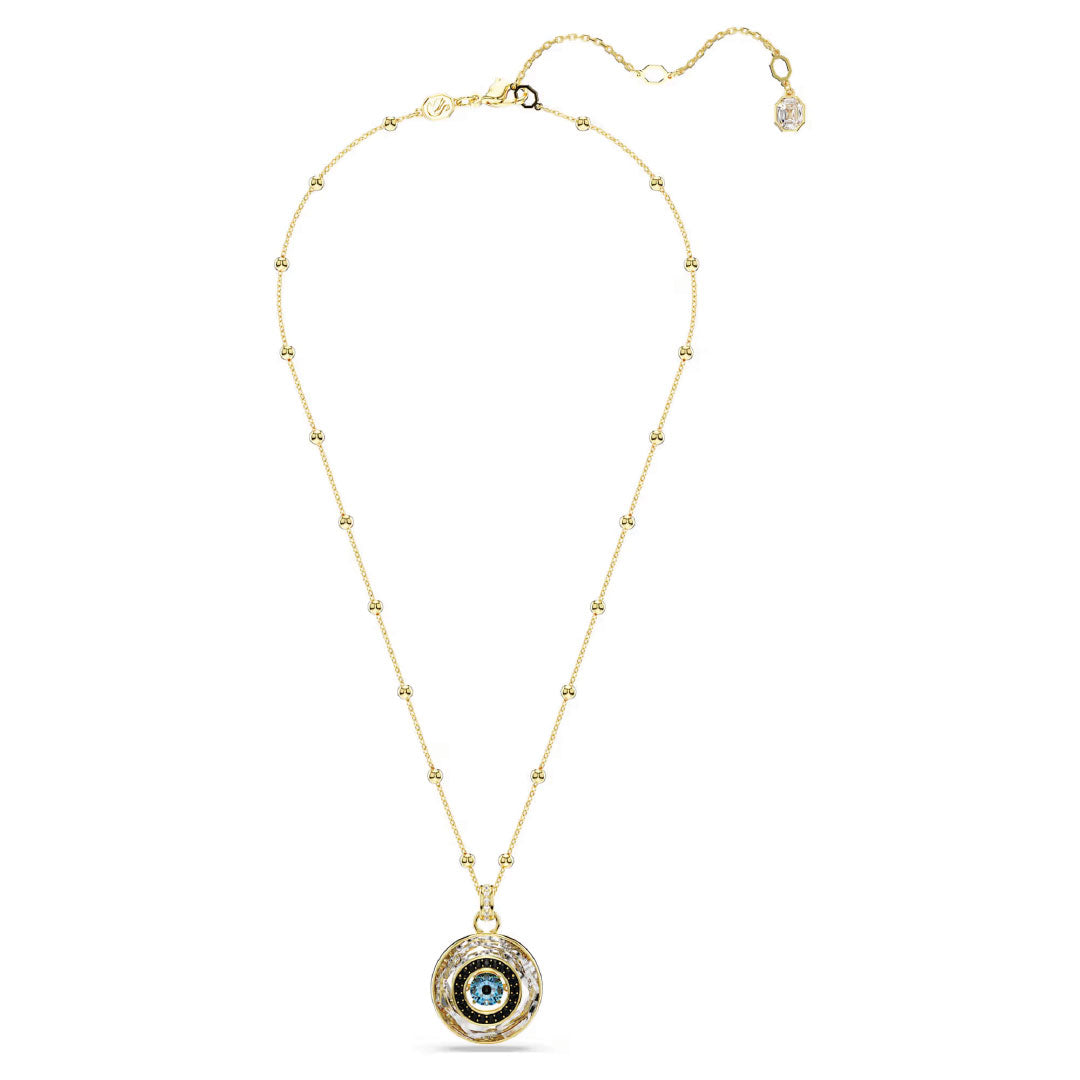 A delicate Swarovski Symbolica Necklace Pendant features a gold chain with small, evenly spaced round beads. It includes a beautifully intricate pendant with a central blue and white circular motif reminiscent of an evil eye charm, exemplifying Swarovski's exquisite jewellery craftsmanship.