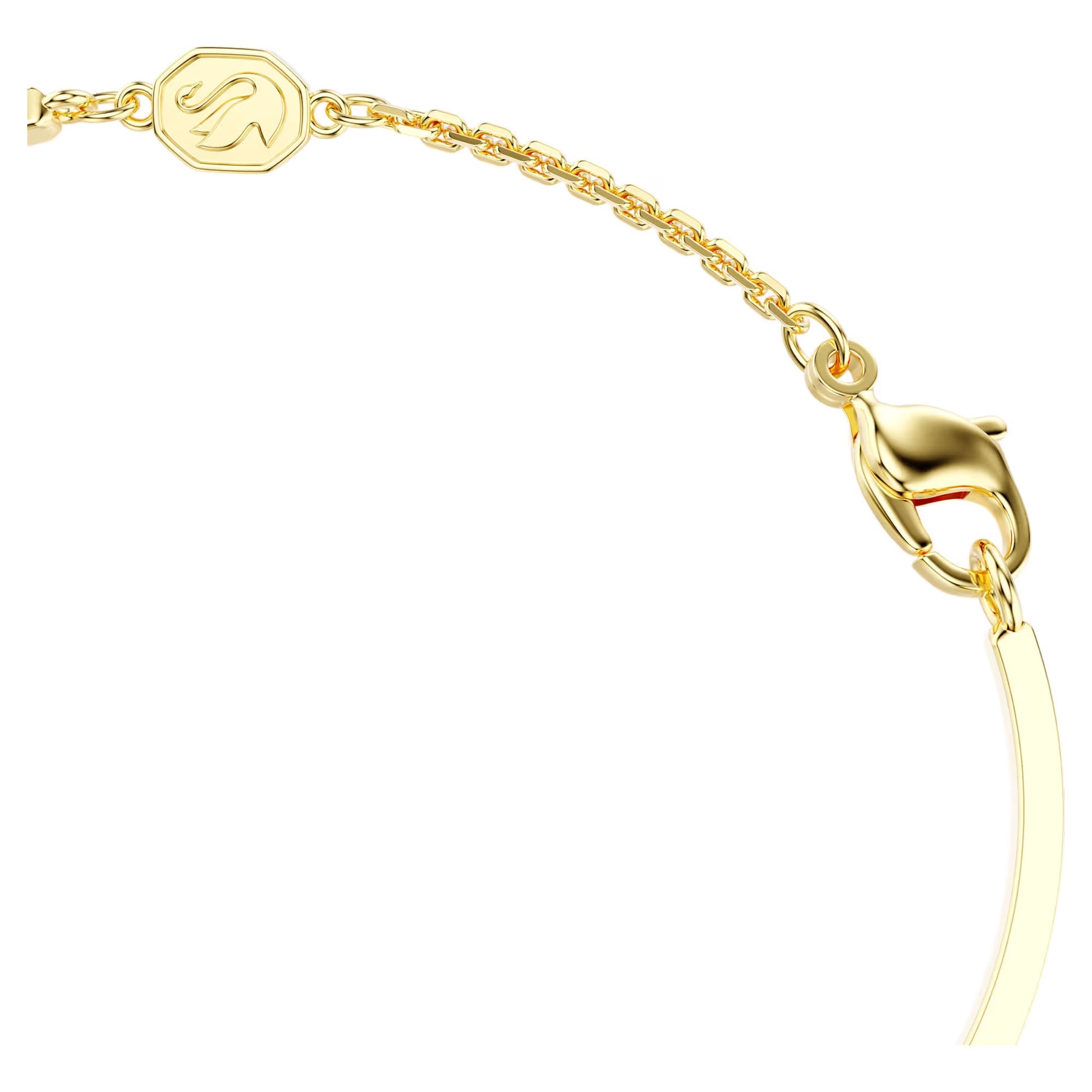 Close-up of a gold-tone plated jewelry bracelet clasp with a delicate chain. The lobster claw clasp features a small hexagonal charm with an engraved letter. Both the chain and clasp are slightly curved, showcasing their polished, shiny surface. It's an exquisite piece from Swarovski's Symbolica Evil Eye Bangle collection.