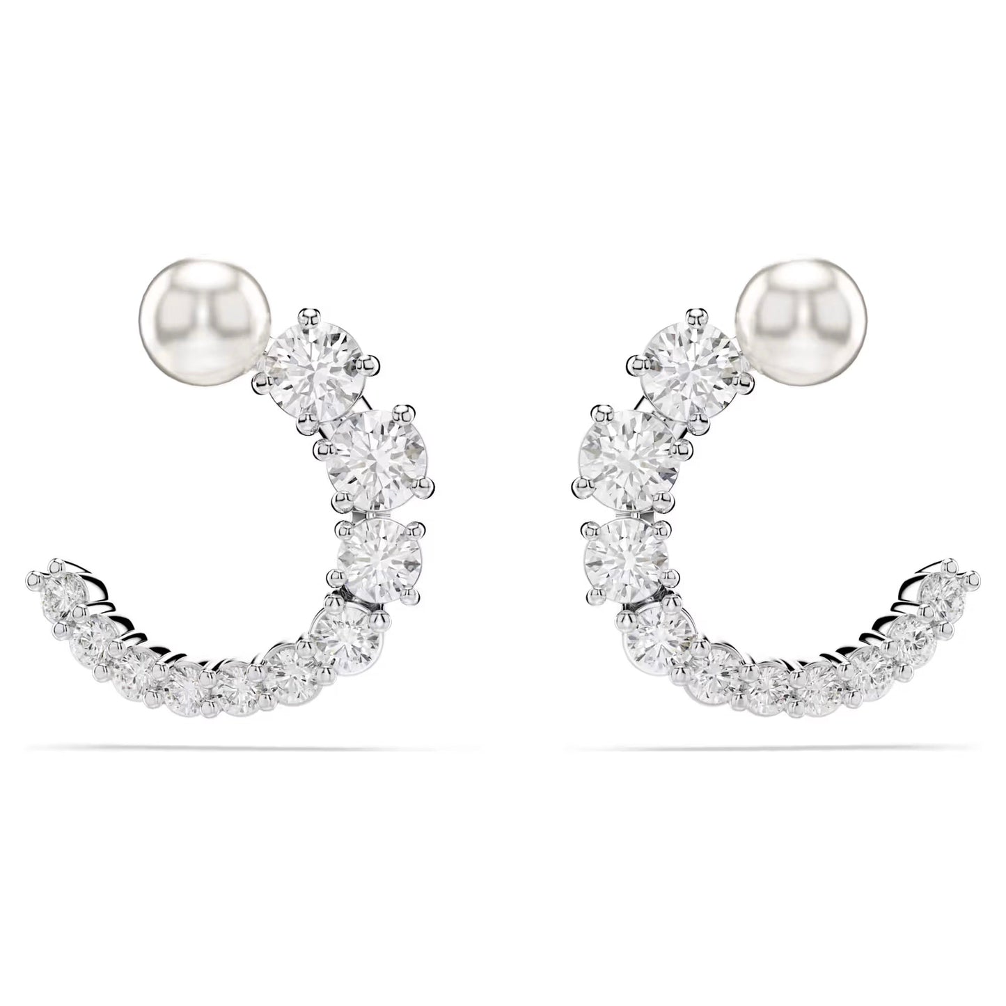 The Swarovski Matrix Hoop Earrings are crescent-shaped, embellished with small round Swarovski Zirconia. A rhodium-plated silver stud tops each earring, with the stones arranged in a row to form an elegant curve against a plain white background.