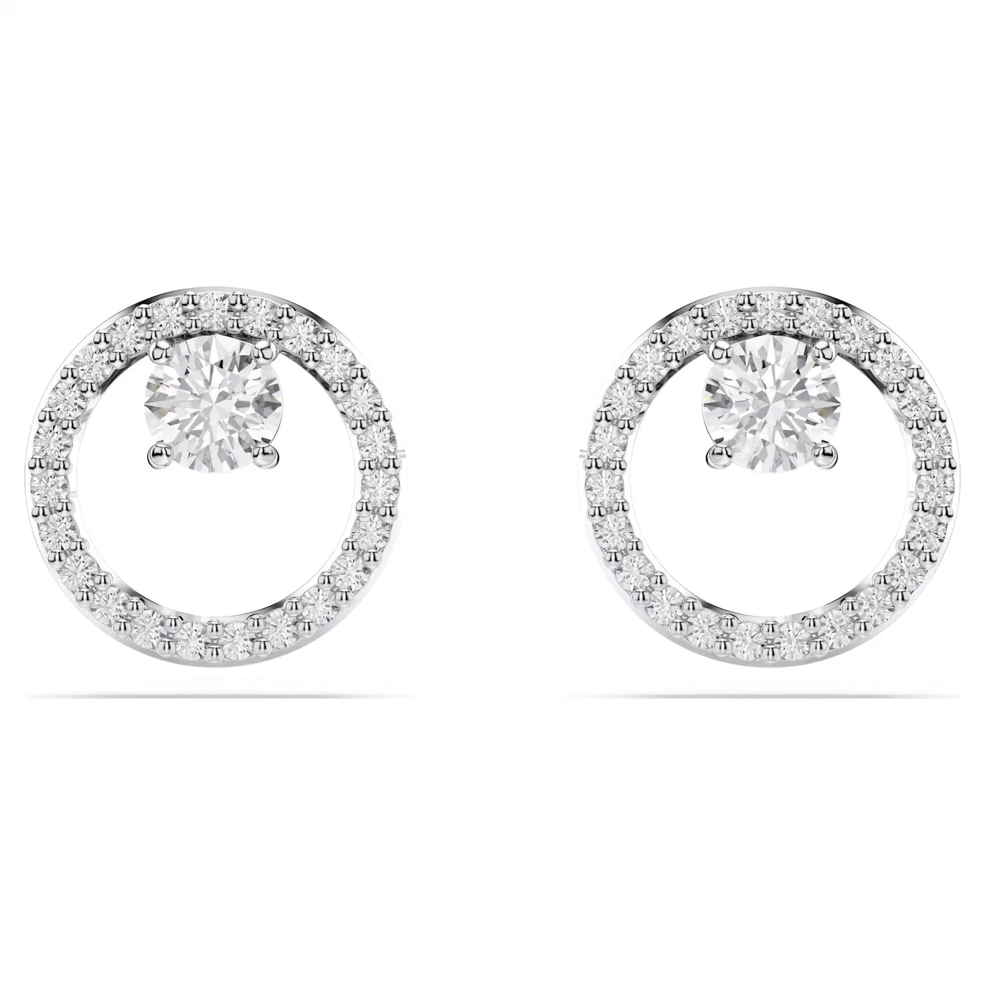The Swarovski Constella Stud Earrings feature a stunning round central diamond encircled by smaller diamonds, amplifying their brilliance. With a rhodium-plated finish for extra sophistication, they shimmer beautifully against a simple white background, providing an elegant and refined appearance.
