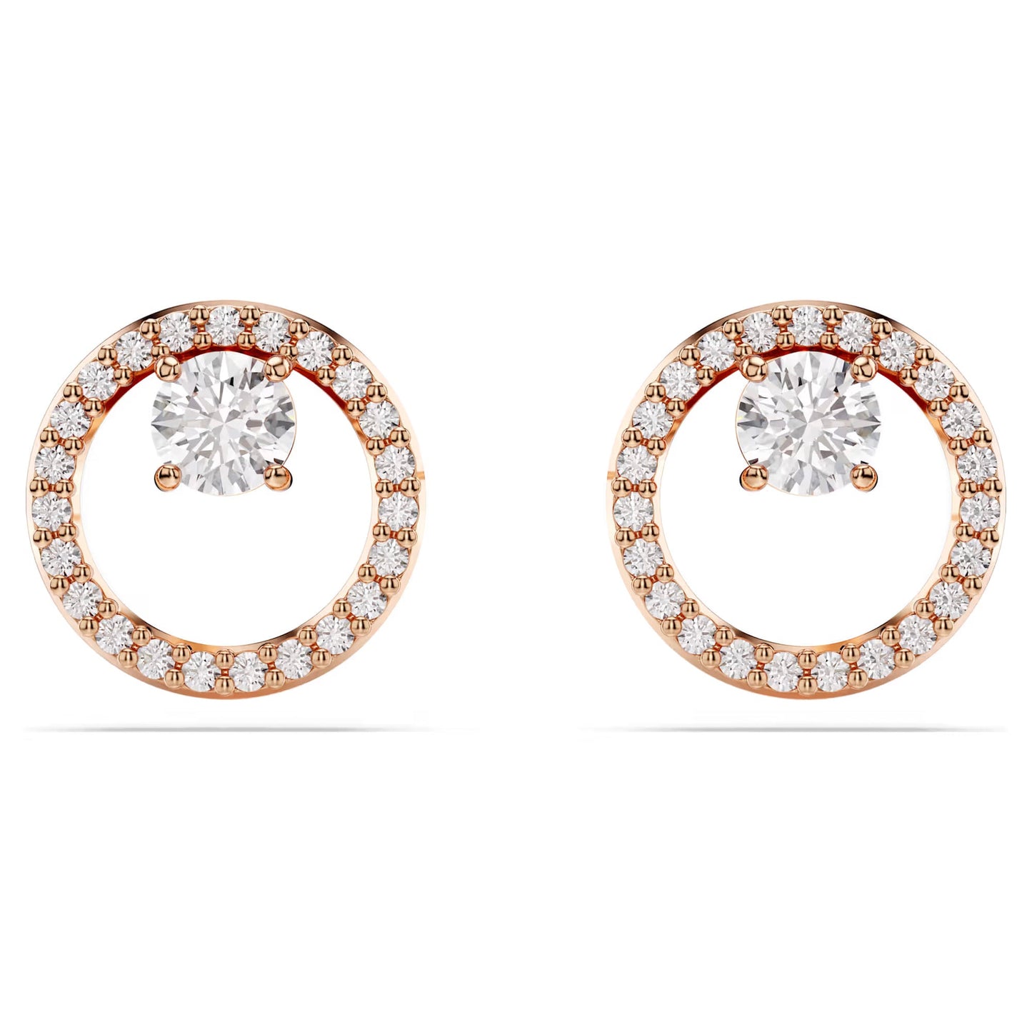 The Swarovski Constella Stud Earrings from Swarovski boast a classic and elegant design with a stunning halo of smaller diamonds surrounding a large central diamond. Enhanced with rose gold-tone plating, these gold circular earrings brilliantly reflect light, capturing the timeless allure of circle studs.