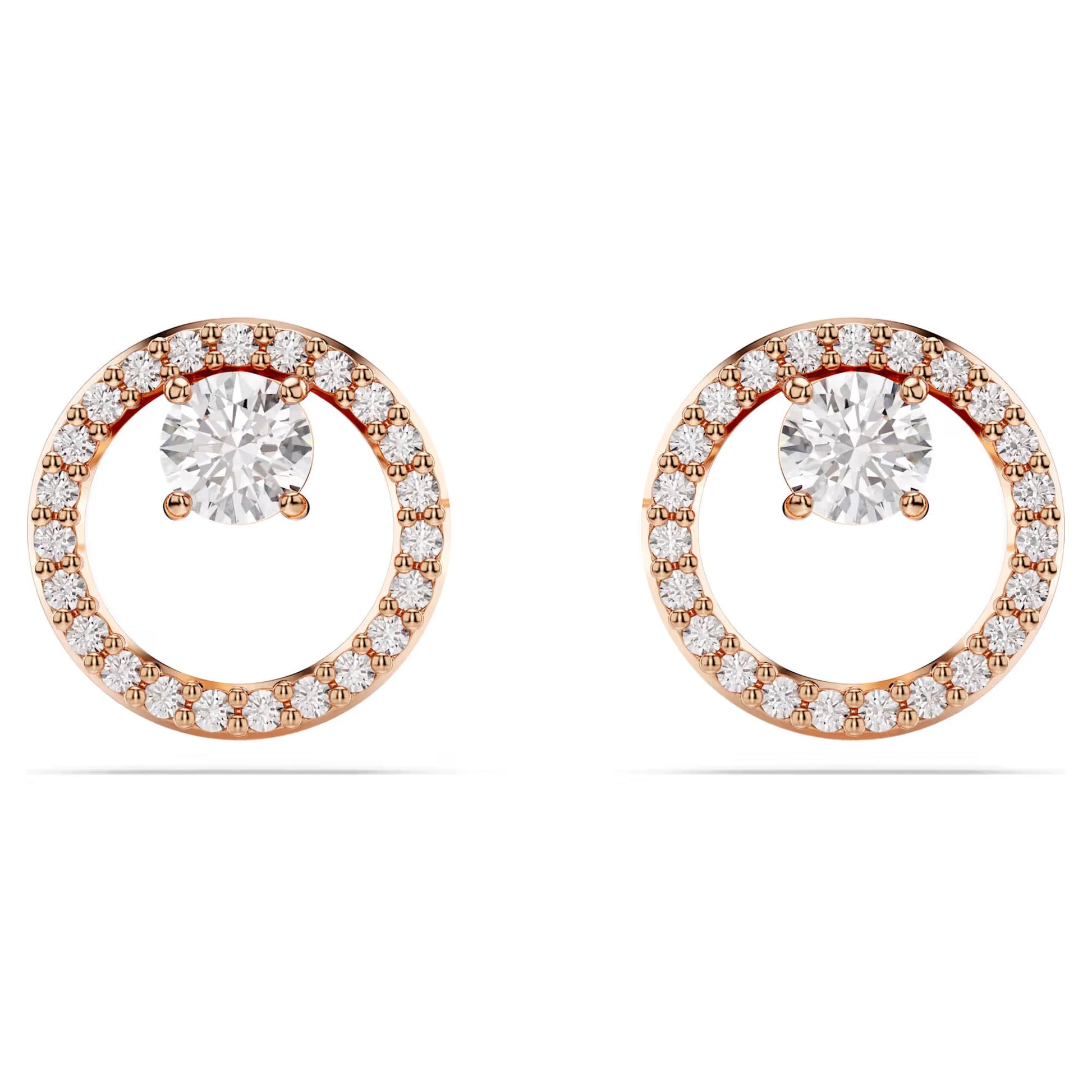 The Swarovski Constella Stud Earrings from Swarovski boast a classic and elegant design with a stunning halo of smaller diamonds surrounding a large central diamond. Enhanced with rose gold-tone plating, these gold circular earrings brilliantly reflect light, capturing the timeless allure of circle studs.