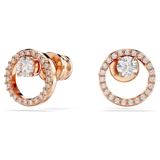The Swarovski Constella Stud Earrings by Swarovski are rose gold-tone plated with circular designs, beautifully adorned with Swarovski Zirconia. Each earring showcases a central diamond surrounded by a ring of smaller diamonds, emphasizing their elegant and sophisticated style.