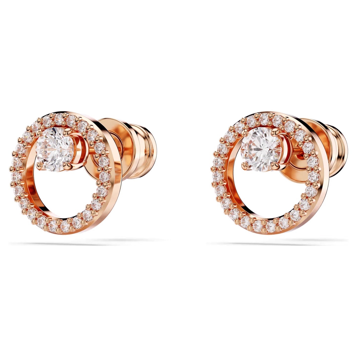 The Swarovski Constella Stud Earrings from Swarovski are a pair of elegant circle studs, featuring a central Swarovski Zirconia encircled by smaller diamonds. These exquisite earrings are set in rose gold-tone plated metal, adding a touch of luxury and sophistication to their circular design.
