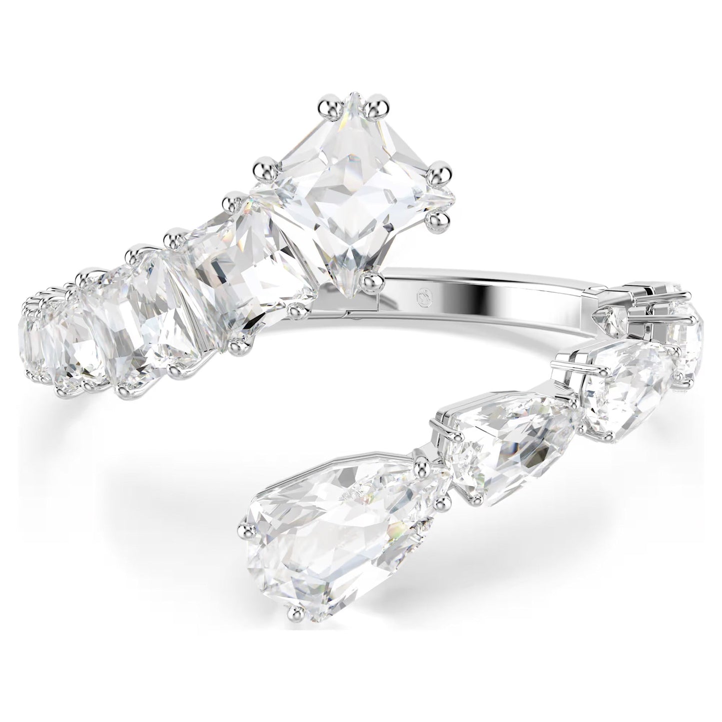 The Swarovski Matrix Bangle by Swarovski is a contemporary and elegant silver open band ring, rhodium plated for added brilliance, featuring large rectangular clear gemstones along its length. The larger stones at the ends enhance its modern and sophisticated design, reminiscent of a gemstone-adorned bangle.