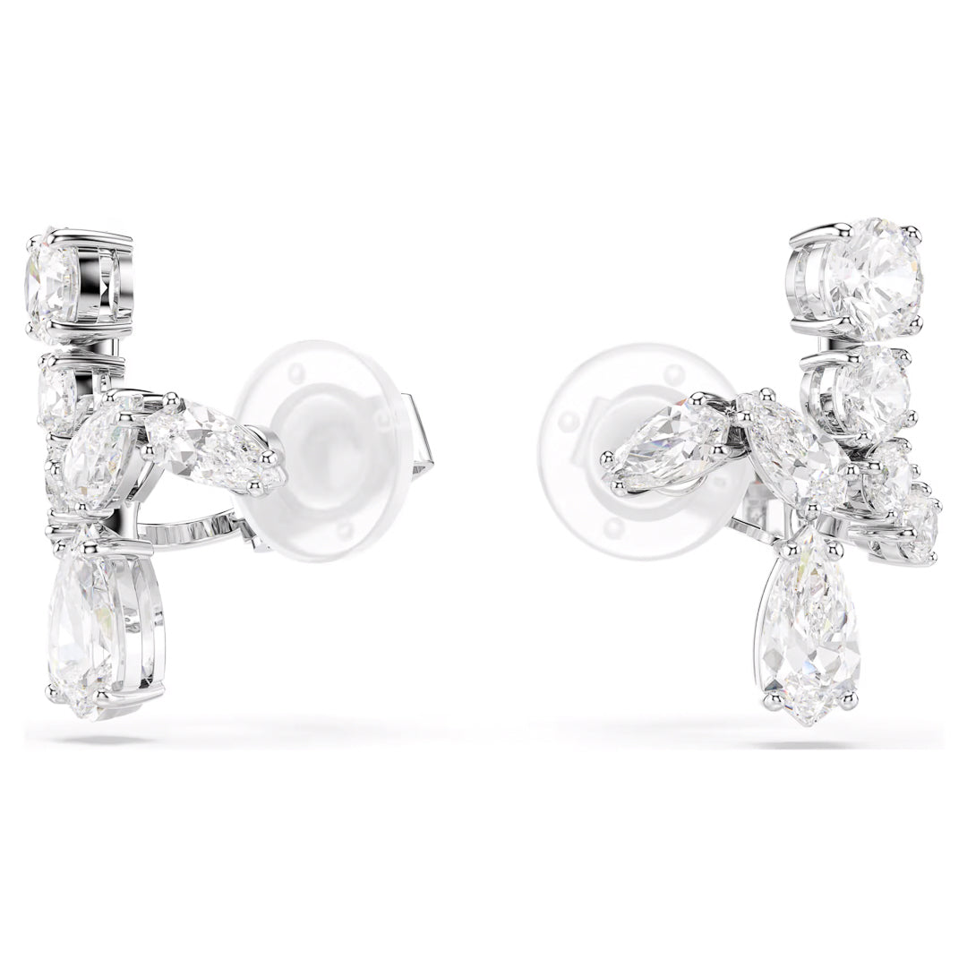 Close-up of the sophisticated Swarovski Matrix Clip Earrings, crafted by Swarovski, featuring a rhodium-plated finish. These elegant earrings are adorned with a cluster arrangement of clear gemstones in various shapes, including marquise and oval cuts, enhanced by brilliant Swarovski Zirconia for a sparkling effect.