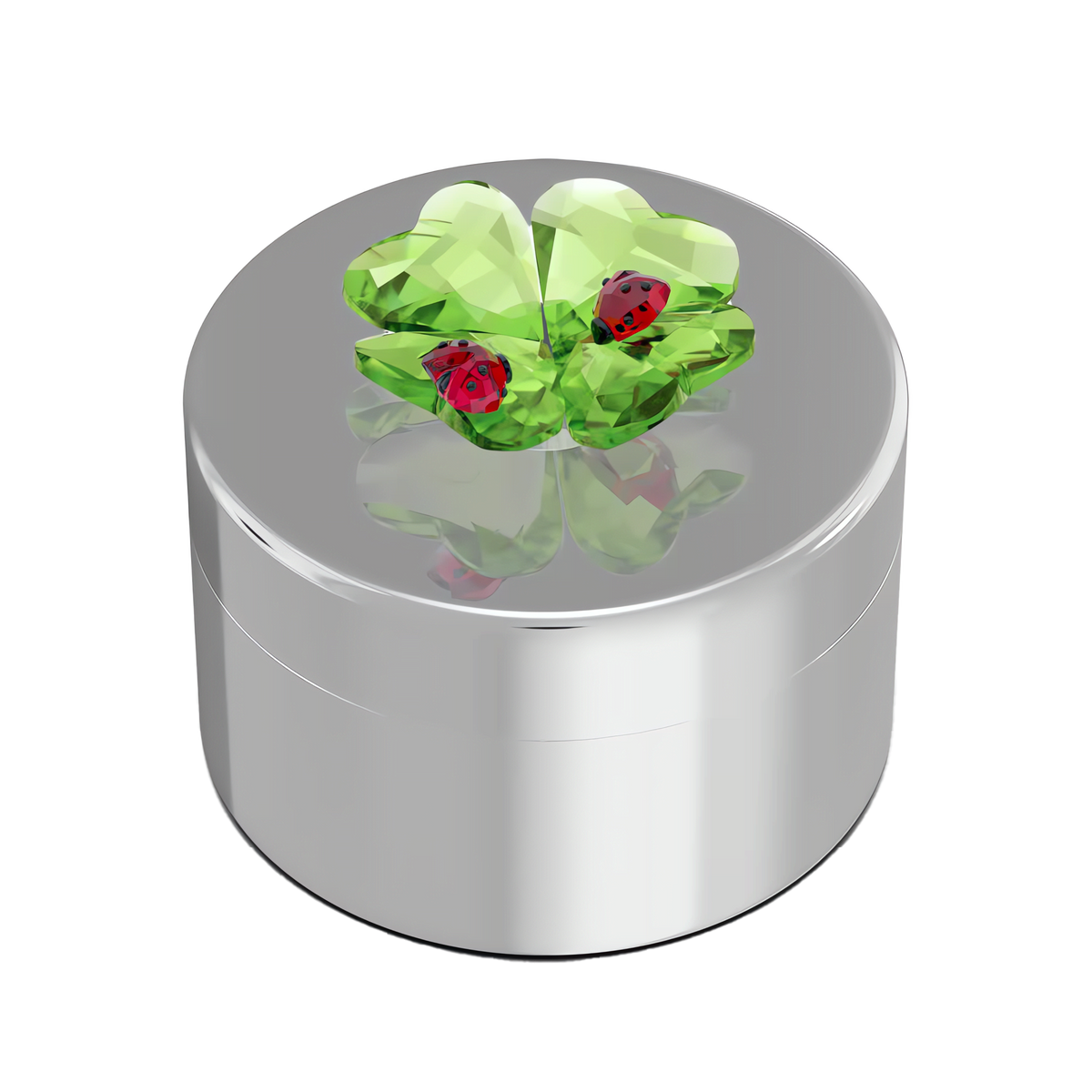 Introducing the Swarovski Idyllia Clover and Ladybug Decorative Box by Swarovski—a gleaming silver box with a lid embellished with a green crystal four-leaf clover and two petite red ladybugs, capturing the enchanting elegance of Swarovski Canada.