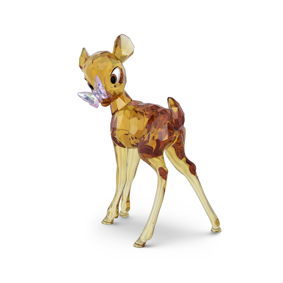 The Swarovski Disney Classics Bambi by Swarovski is a dazzling crystal figurine of a fawn with large, expressive eyes, standing gracefully on slender legs with a delicate purple butterfly perched on its nose. Reminiscent of beloved Disney collectibles, this sparkling piece is perfect for display and is showcased against a plain white background.