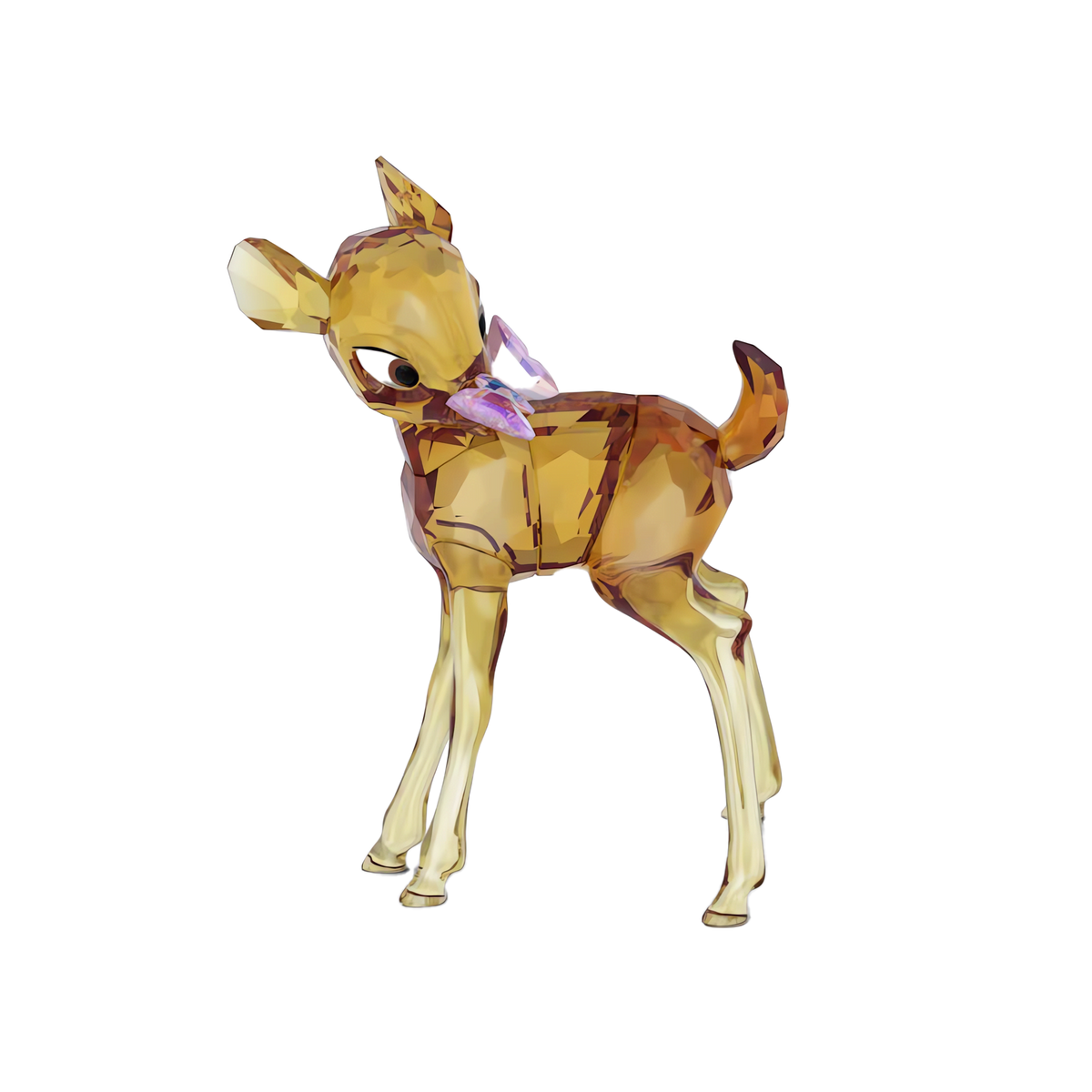 A faceted amber-colored glass sculpture depicting a young deer stands on four legs with its head turned slightly to the side and one ear raised, accented by a touch of purple on its neck—an exquisite Swarovski Disney Classics Bambi figurine crafted by Swarovski in shimmering crystal and inspired by the beloved Disney collectible.