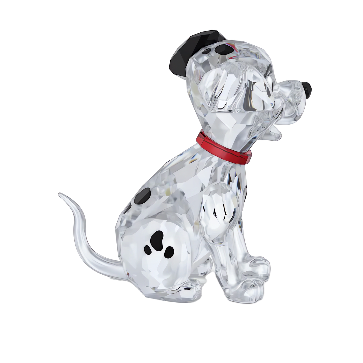 The Swarovski Disney Classics 101 Dalmatians - Lucky figurine by Swarovski is a collectible crystal piece depicting a Dalmatian puppy with black spots, a red collar, and one black ear, sitting with its tail curled on a white background, inspired by Disney’s 101 Dalmatians.