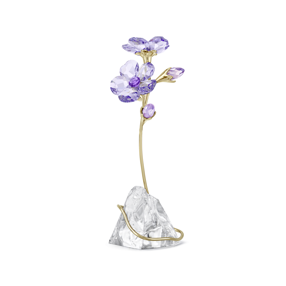 Adorn your home with the Swarovski Florere Rozanne—a refined crystal flower inspired by the beauty of the Rozanne Geranium, featuring exquisite purple crystal petals and gold-toned stems, elegantly displayed on a clear, faceted base reminiscent of sparkling rock.