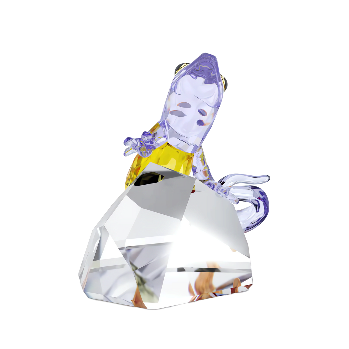 The Swarovski Idyllia Gecko by Swarovski is a charming crystal figurine featuring a stylized glass gecko with purple and yellow accents perched atop a large, faceted crystal. Perfect for colorful home decor, this delightful piece is set against a plain white background.