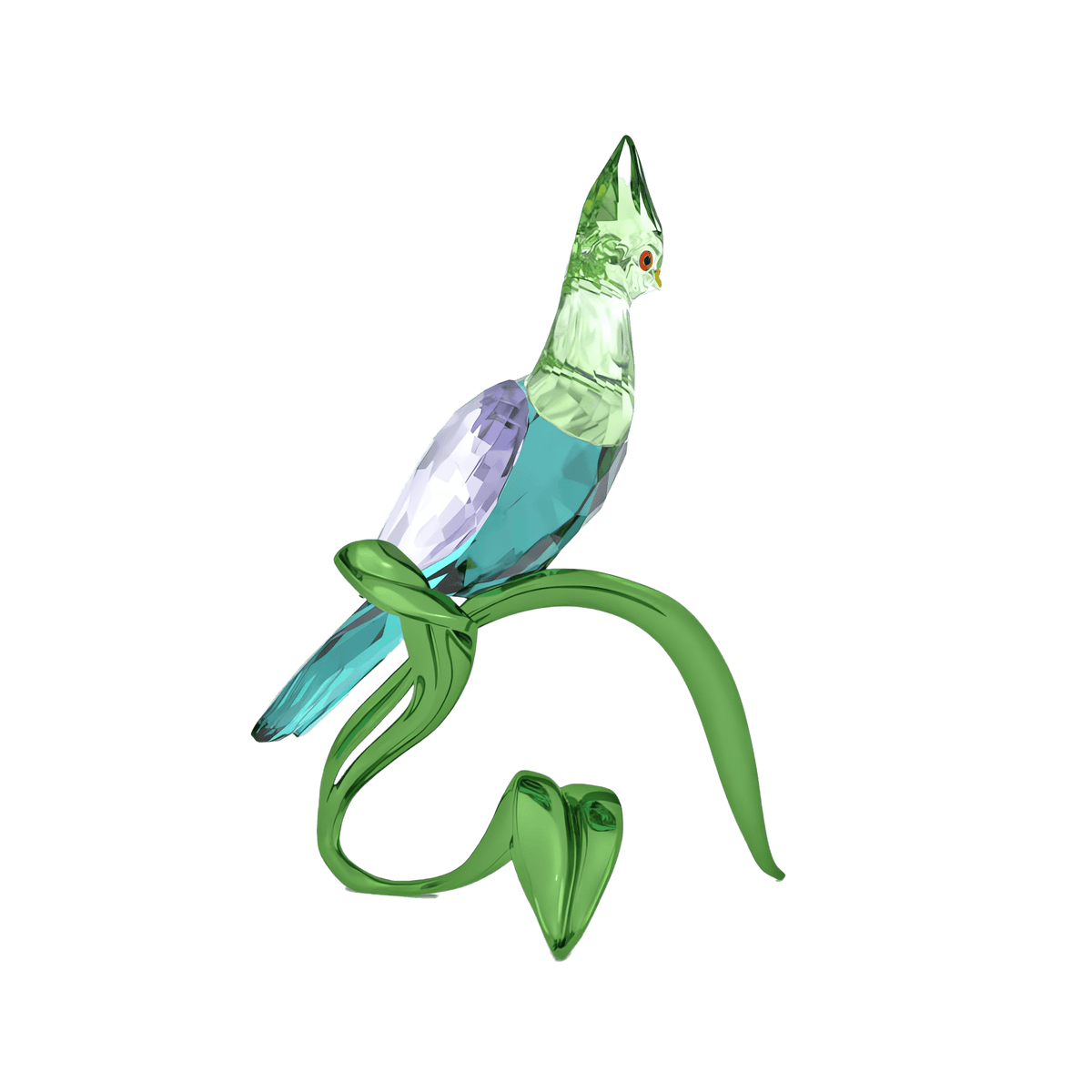A green and light purple crystal bird with a red eye sits perched on a green curved branch against a plain white background, making the Swarovski Idyllia Green Turaco by Swarovski a striking choice for home decoration.