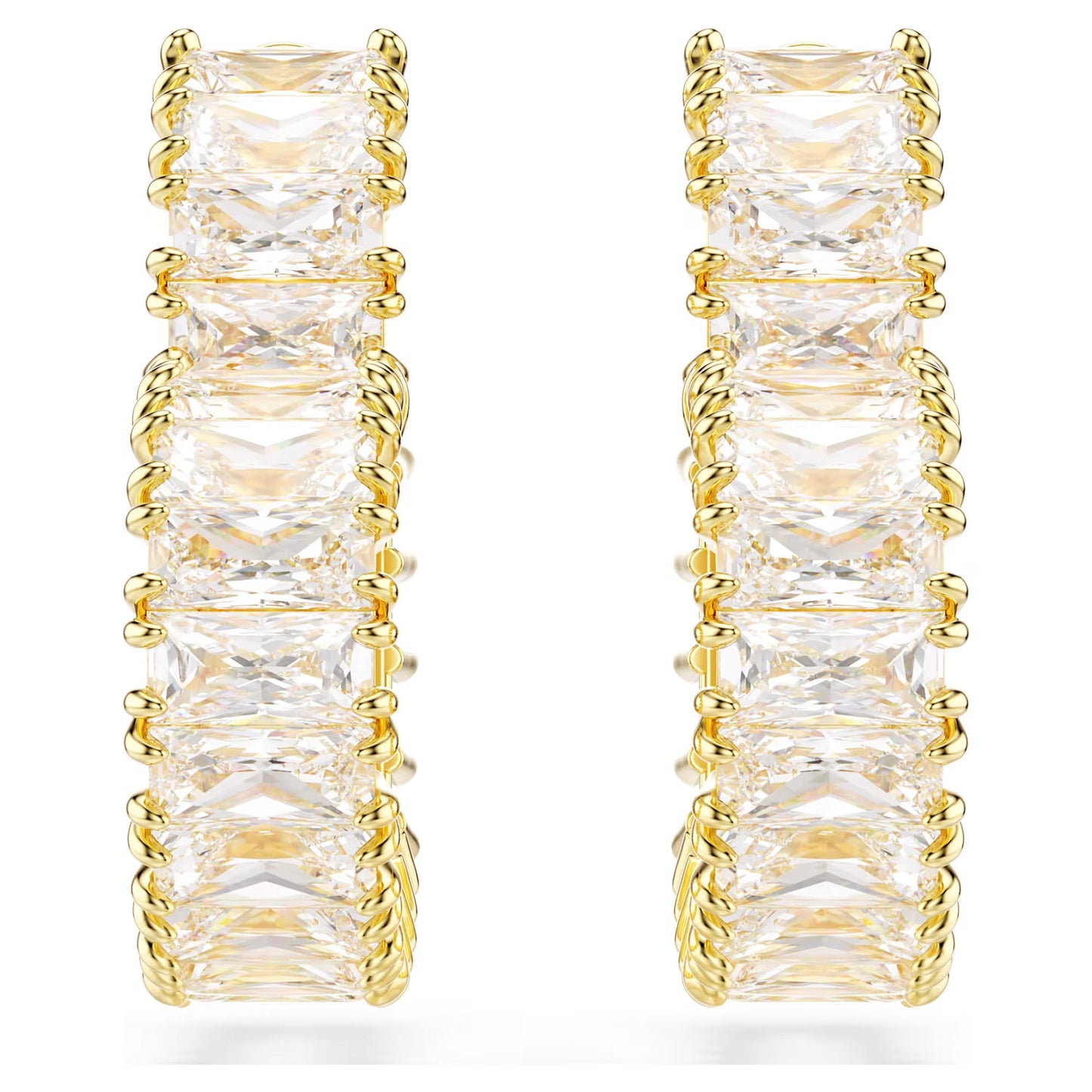 The Swarovski Matrix Heart Hoop Earrings by Swarovski are gold-tone plated hoops featuring a series of square-cut diamonds set in gold prongs. Adorned with sparkling Swarovski Zirconia, they boast a symmetrical and elegant design against a plain white background.
