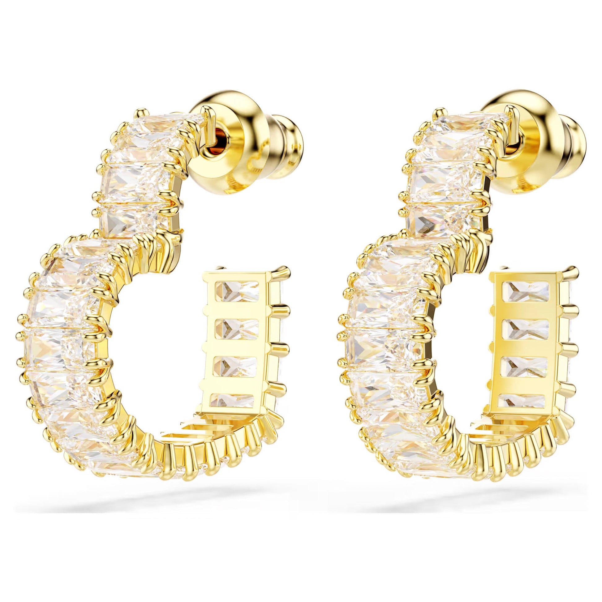 The Swarovski Matrix Heart Hoop Earrings by Swarovski are gold-tone plated and adorned with square-cut clear gemstones set in a half-circle design. These earrings exude elegance and luxury with their shiny finish and structured layout, featuring the brilliance of Swarovski Zirconia to enhance any outfit.