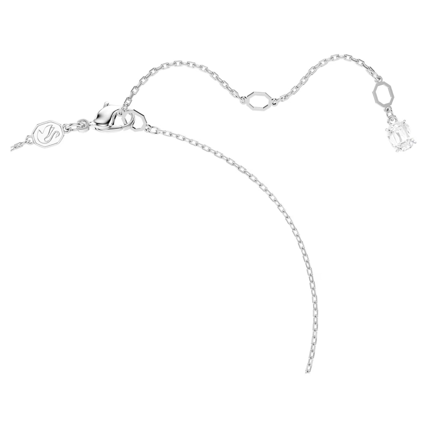 A refined necklace pendant by Swarovski featuring a slim chain and a small geometric charm adorned with a clear Swarovski Zirconia. The necklace comes with a secure lobster clasp, an adjustable chain, and an additional small charm near the clasp.
