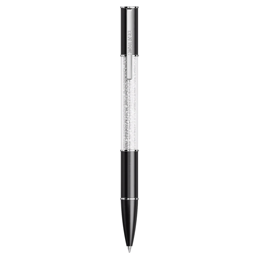 The Swarovski Crystalline Lustre Ballpoint Pen is a sophisticated writing instrument featuring an elegant black and silver design. It boasts an upper barrel adorned with dazzling crystals, while the solid black lower barrel and tip create a captivating contrast to the sparkling Swarovski-encrusted upper section.