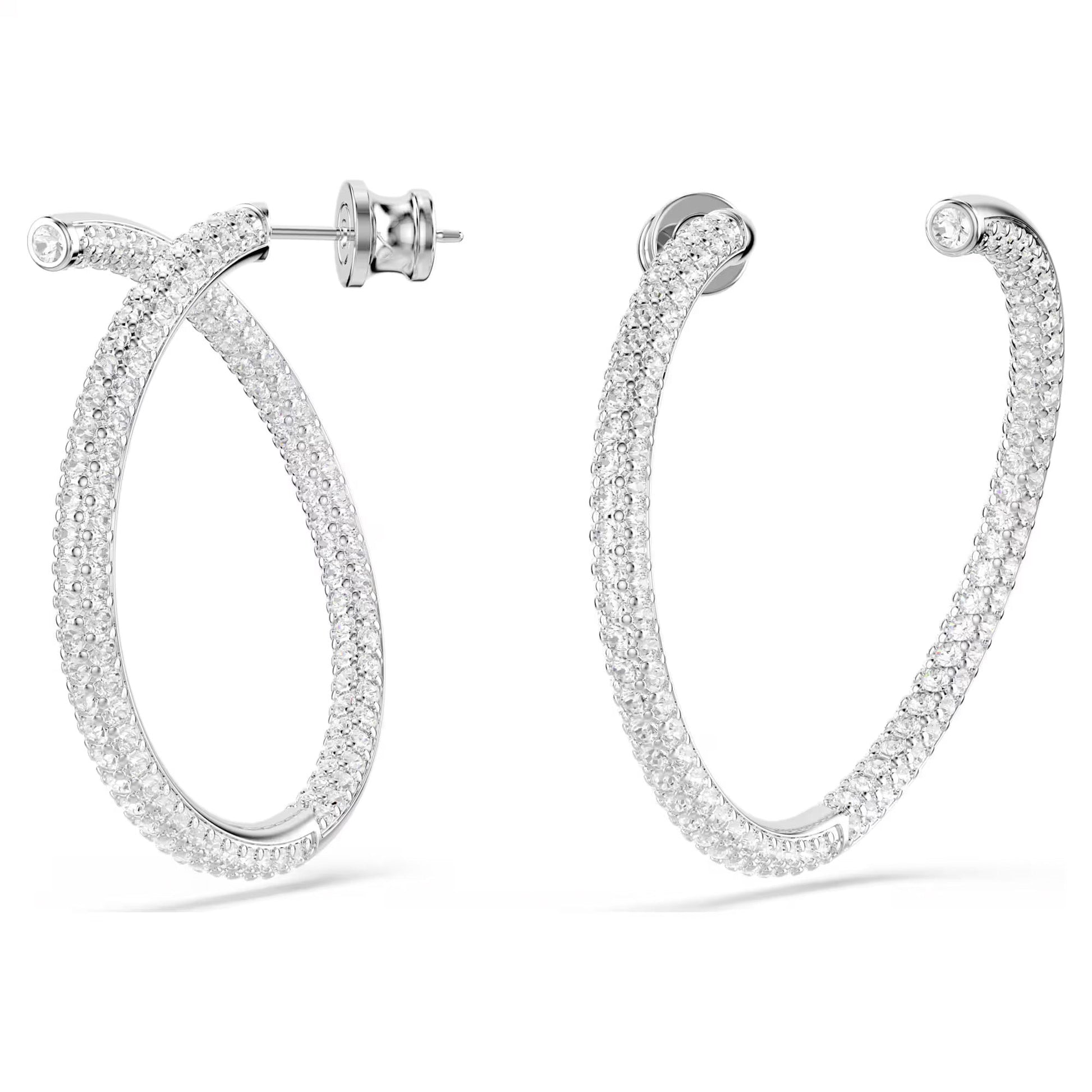 The Swarovski Dextera Hoop Earrings feature an oval-shaped design adorned with clear pavé stones and come with a classic post and butterfly back closure. Their rhodium-plated finish enhances the polished look, highlighting the intricate detailing of the dazzling stones.
