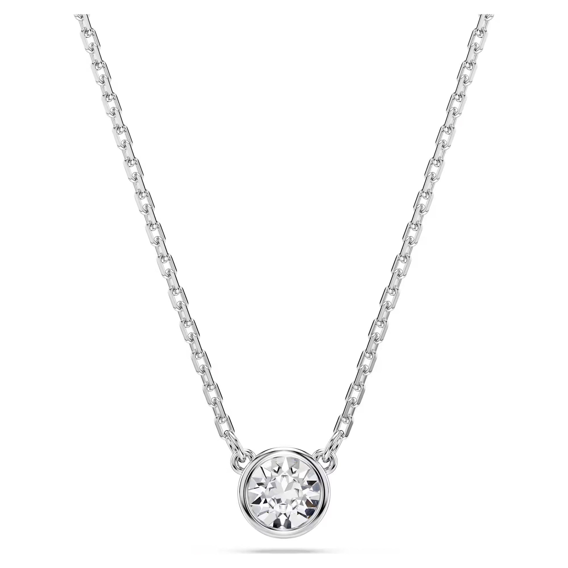 The Swarovski Imber Necklace Pendant by Swarovski showcases a delicate silver chain and a round, sparkling Swarovski Zirconia pendant set in an elegant minimalist bezel setting, enhanced with a rhodium plating.