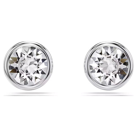 The Swarovski Imber Stud Earrings are a pair of round, rhodium-plated silver studs adorned with large, clear gemstones that reflect light brilliantly. These crystal earrings showcase a simple and elegant design, echoing the timeless elegance of classic Swarovski pieces.