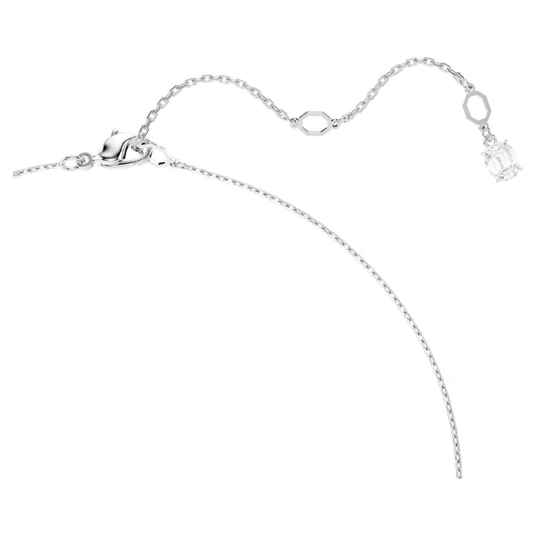 Discover the exquisite Swarovski Hyperbola Necklace Pendant, a delicate silver piece showcasing a thin chain adorned with two small hexagonal charms. Featuring a clear Swarovski Zirconia gemstone that elegantly hangs at one end, this necklace is rhodium plated for an extra shine. Displayed flat against a white background, it epitomizes sophistication and elegance.