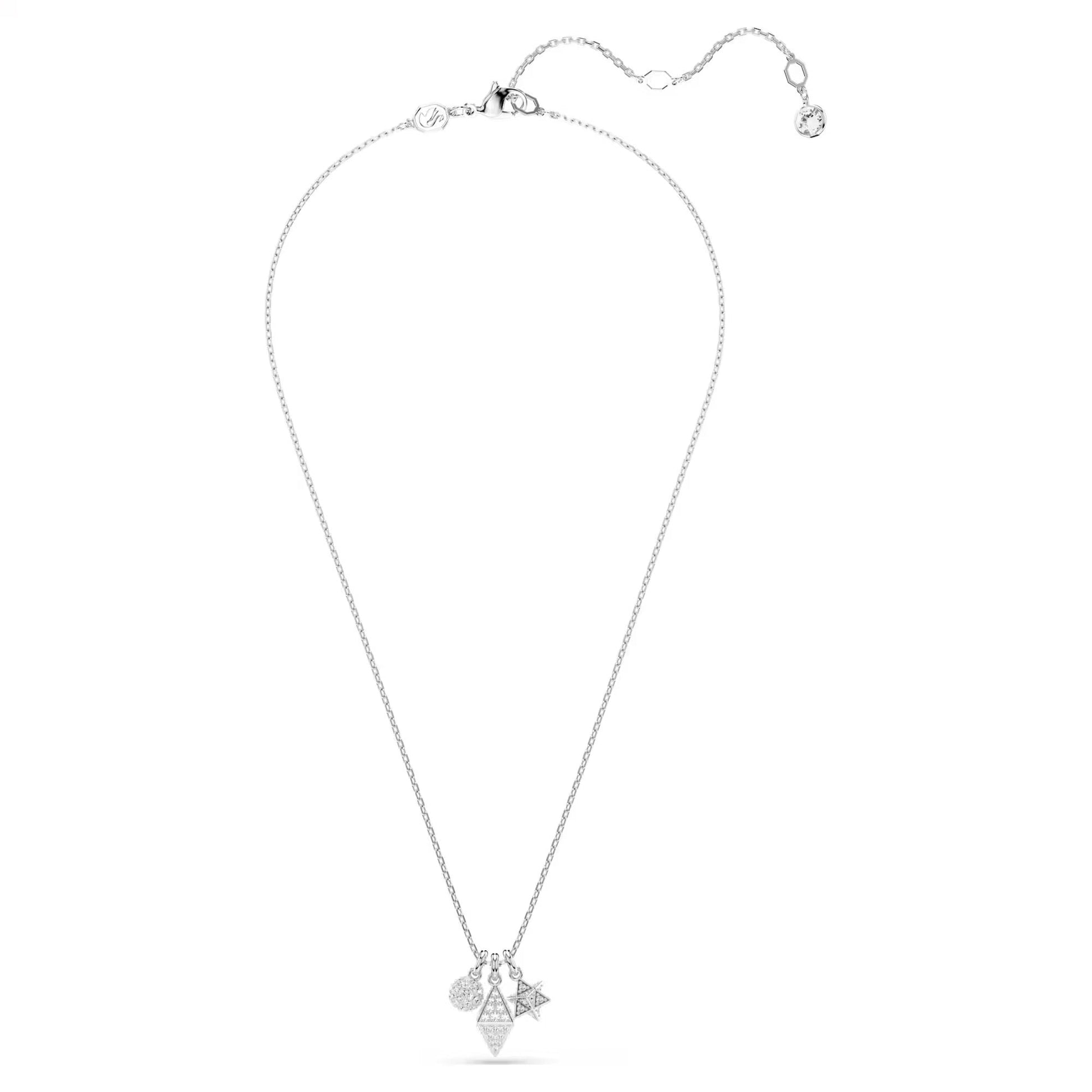 The Swarovski Dextera Necklace Pendant by Swarovski showcases a delicate silver chain featuring a geometric pendant adorned with three charming shapes - a star, heart, and triangle, all embellished with pavé crystals. The necklace includes an adjustable clasp and is finished with a small elegant detail at the end, embodying an elegant and minimalistic design.