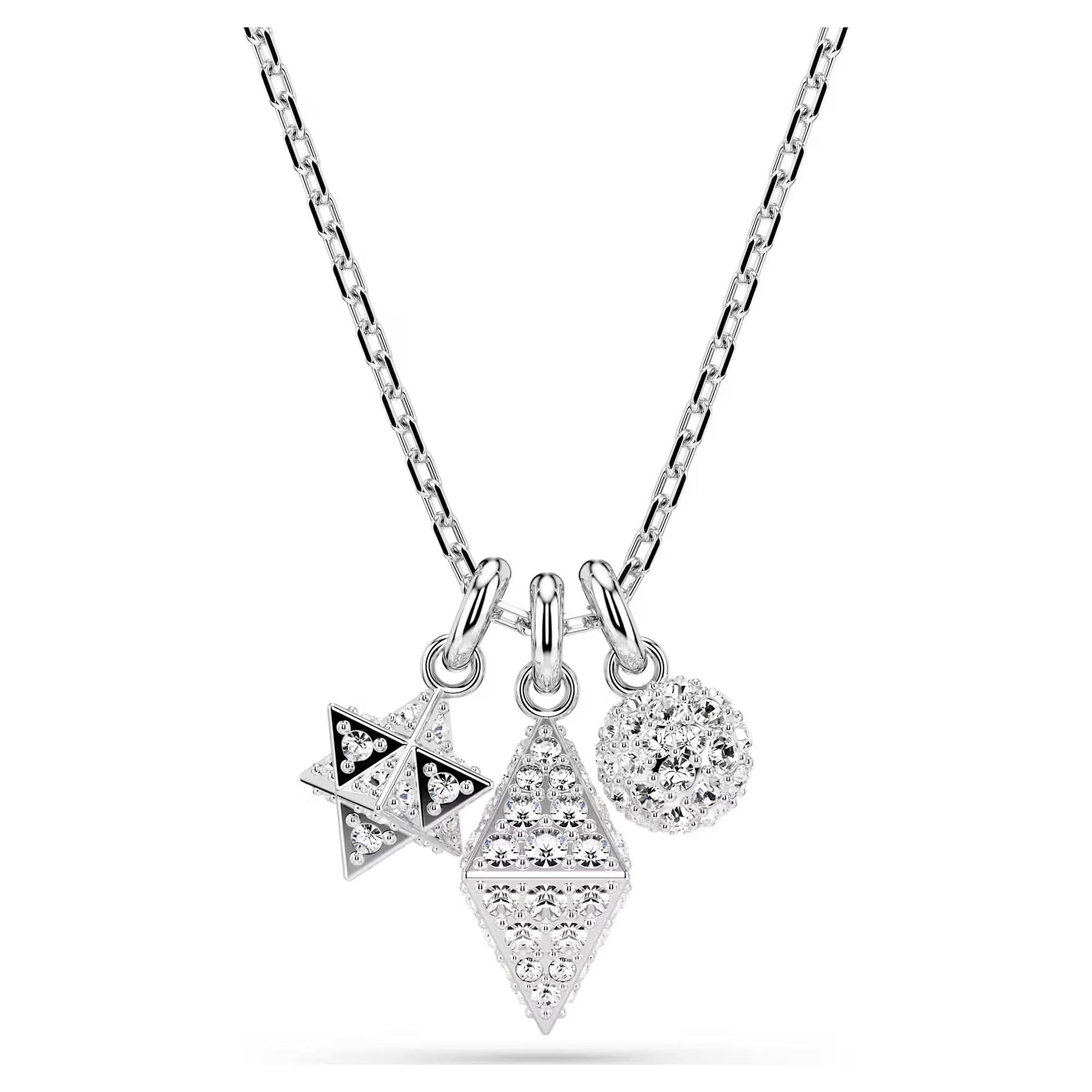 The Swarovski Dextera Necklace Pendant is a silver necklace adorned with geometric pendants, including a starburst, a diamond shape, and a round cluster, all encrusted with pavé crystals.