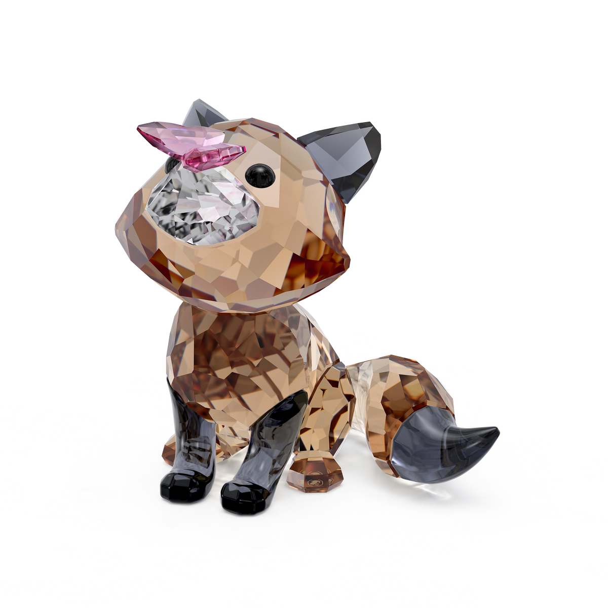 The Swarovski Idyllia Fox and Butterfly by Swarovski is a faceted crystal animal collectible figurine featuring a sitting fox with a bushy tail, brown and black coloring, and a pink nose, displayed on a plain white background. This elegant decoration makes a refined addition to any collection.