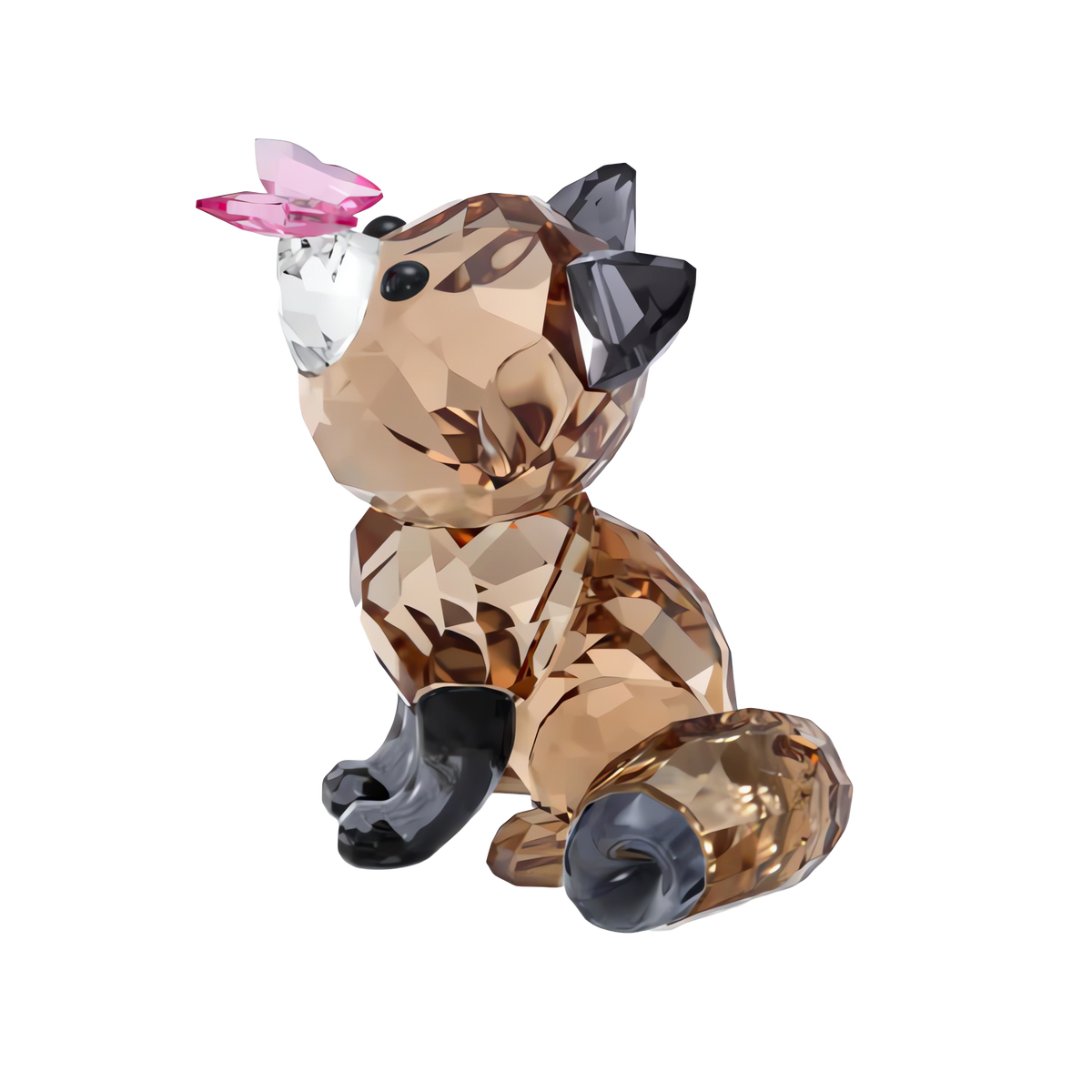 The Swarovski Idyllia Fox and Butterfly figurine features a small, faceted crystal fox with dark paws and ears sitting upright, gazing up at a delicate pink crystal butterfly perched on its nose. This charming collectible from Swarovski is a delightful decorative piece that stands out beautifully against a plain white background.