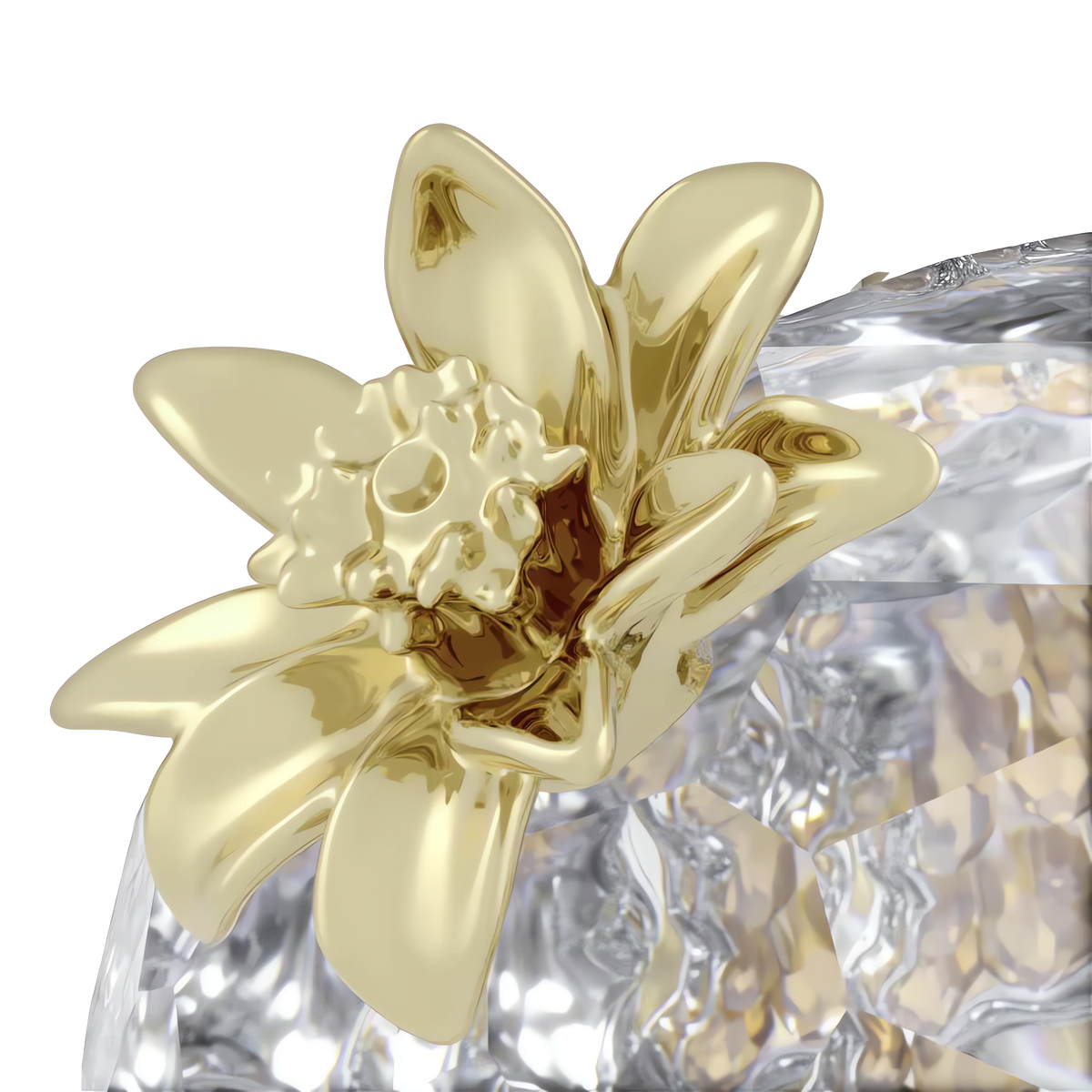 A close-up of the Swarovski Idyllia Pomegranate showcases its intricate gold petals and detailed center, set against a faceted, transparent crystal background, creating an elegant Swarovski crystal table decor piece.