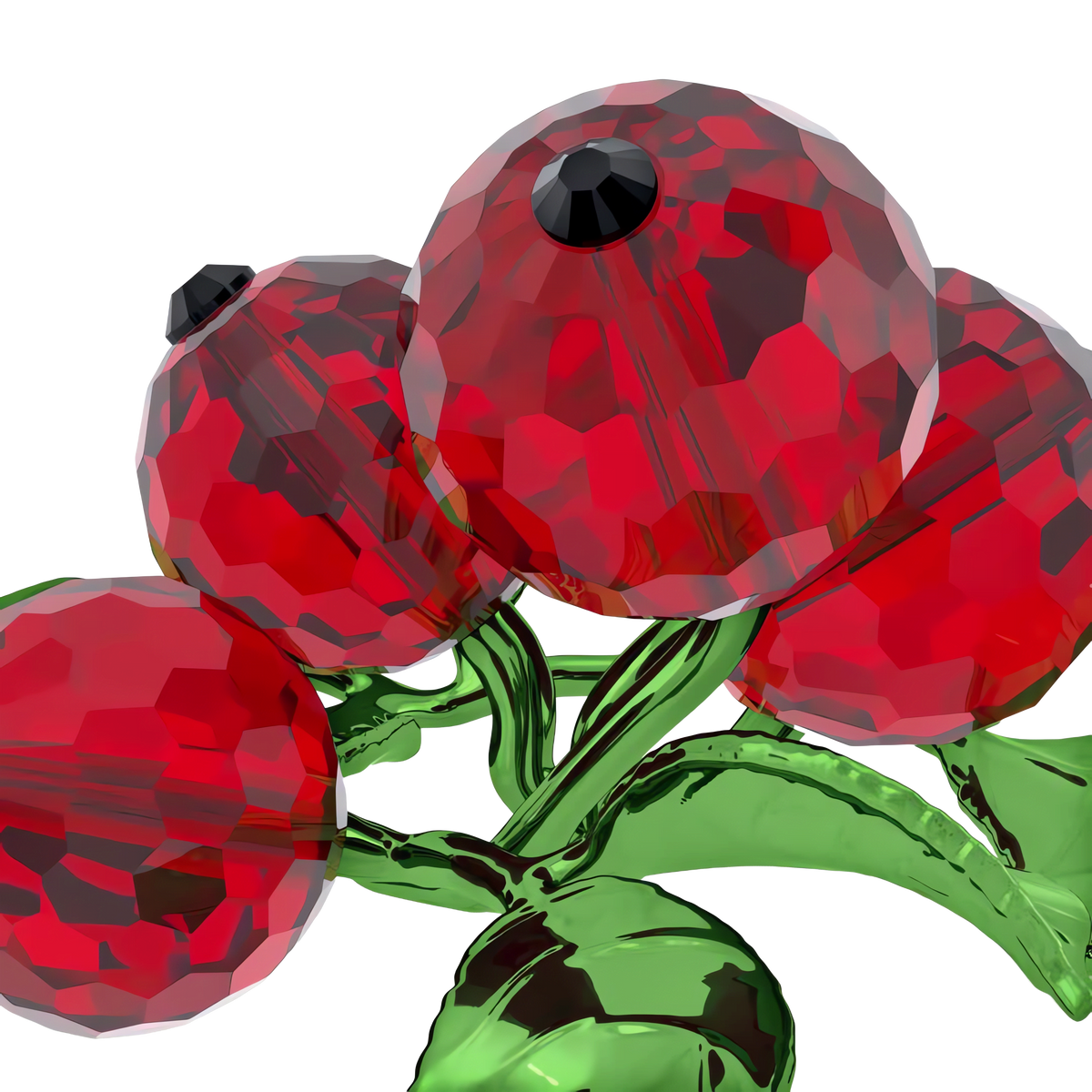 A close-up shows four faceted red berries with black tops and green leaves, each element meticulously crafted as part of the Swarovski Idyllia Red Berries decoration by Swarovski, set against a plain white background.