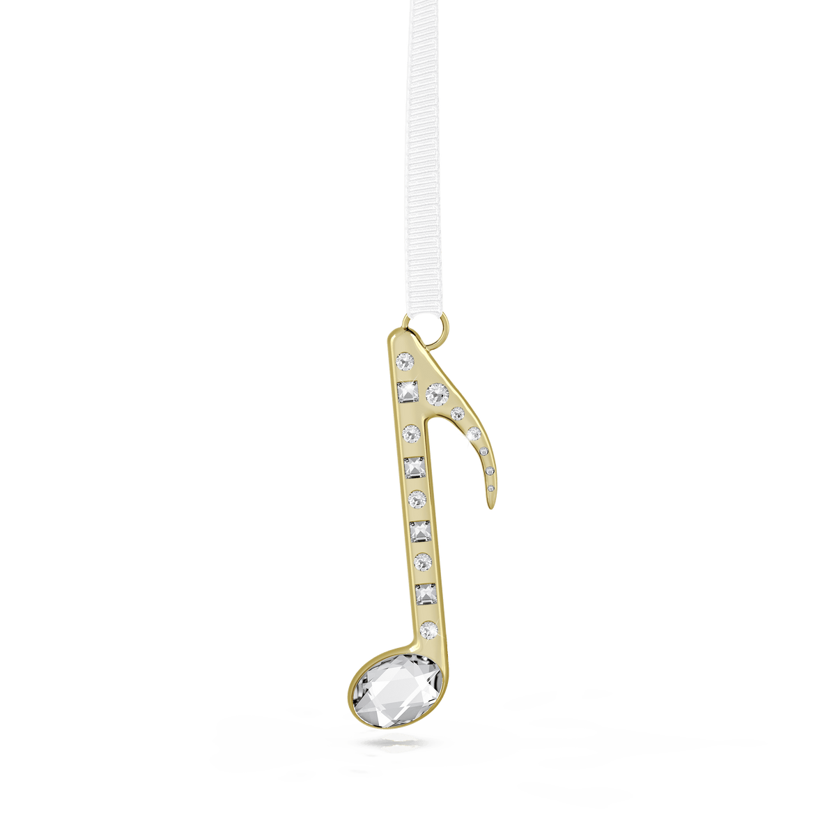The Swarovski Holiday Magic Music Note Ornament by Swarovski, featuring a champagne gold-tone and embellished with clear crystals, is suspended from a white ribbon against a plain, light background.