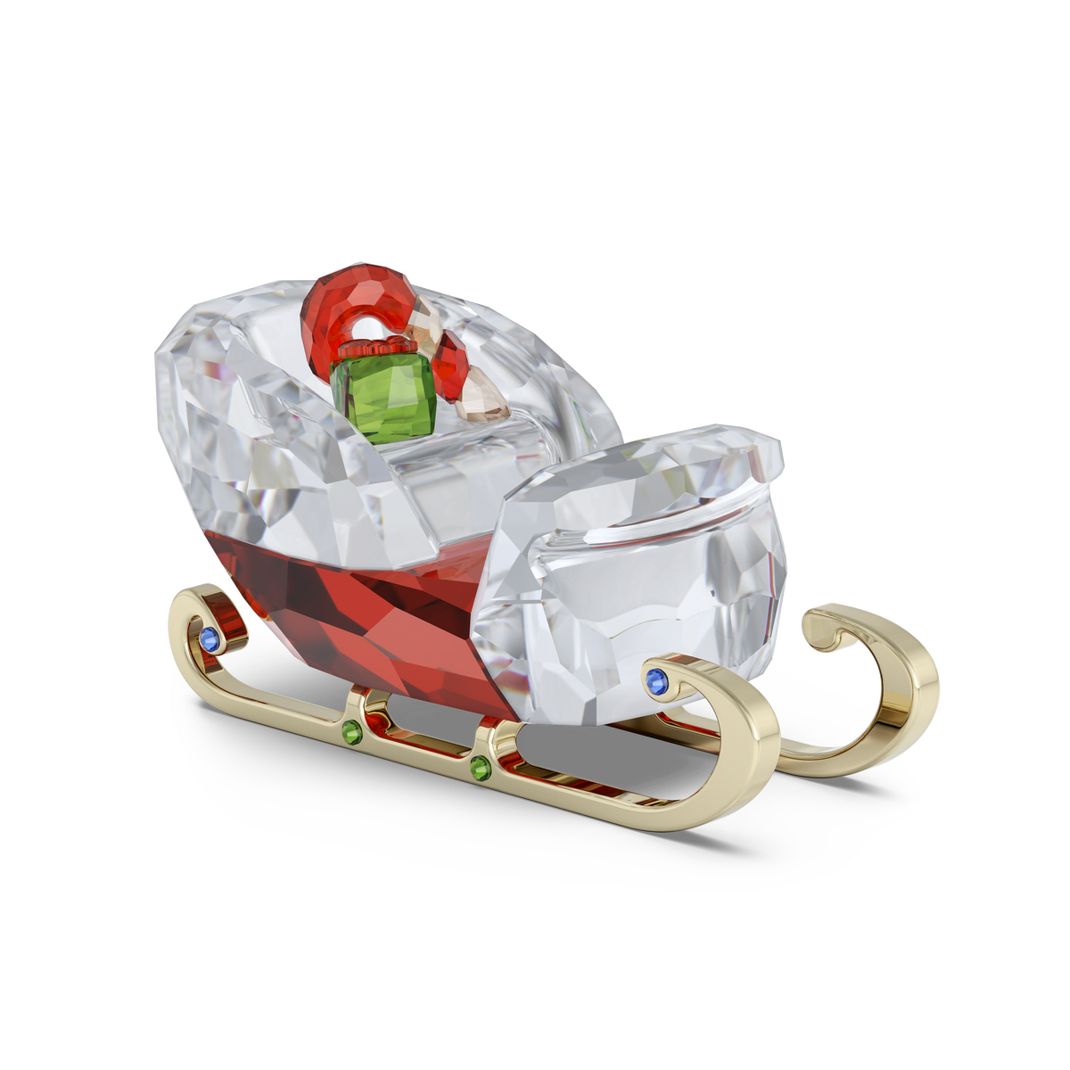 The Swarovski Holiday Cheers Sleigh by Swarovski is a decorative crystal figurine featuring gold-colored runners, a red and clear body, and small green and red crystal presents inside—all set against a white background—making it the perfect sparkling holiday decoration.