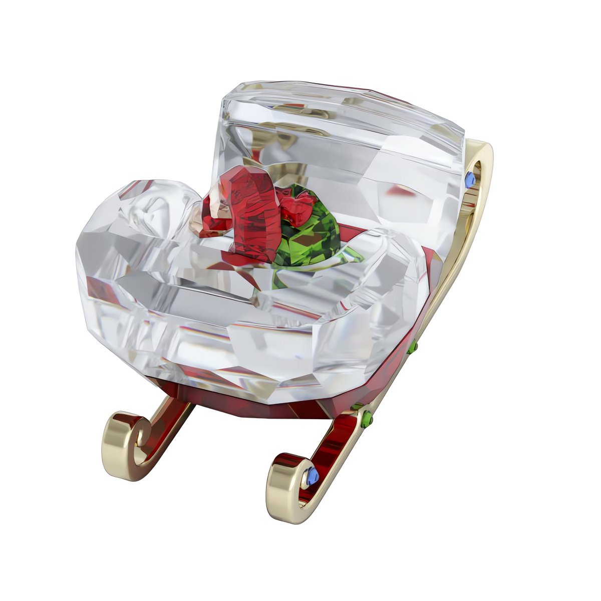 The Swarovski Holiday Cheers Sleigh by Swarovski features a sparkling crystal Santa sleigh with gold runners and red and green crystal gifts, making a stunning holiday decoration displayed on a crisp white background.