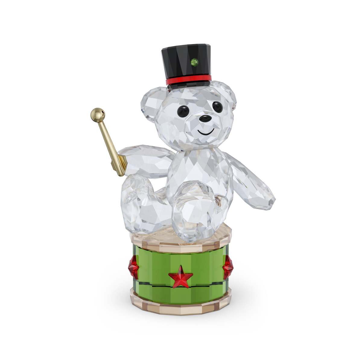 The Swarovski Kris Bear Holiday Annual Edition 2025 figurine features a charming crystal bear from Swarovski, wearing a black top hat and sitting on a green drum adorned with red stars while holding a gold drumstick. This limited edition collectible from Swarovski shines with a joyful expression.