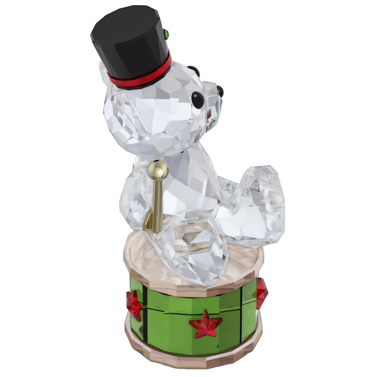 The Swarovski Kris Bear Holiday Annual Edition 2025 by Swarovski features a clear, faceted bear with black eyes and nose, wearing a black top hat and seated on a green drum adorned with red stars and gold accents. This festive collectible beautifully embodies holiday cheer against a white background.