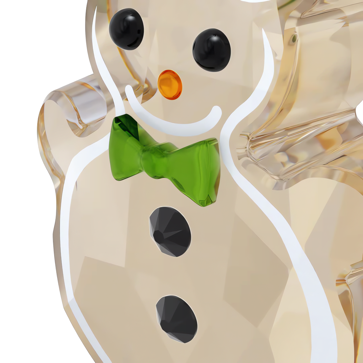 A close-up of a transparent glass snowman figurine with black eyes, a carrot-shaped orange nose, a green bow tie, and black buttons is shown against a white background—an enchanting holiday gift crafted in the spirit of Swarovski elegance and perfect to complement the Swarovski Holiday Cheers Gingerbread Ornament Set.