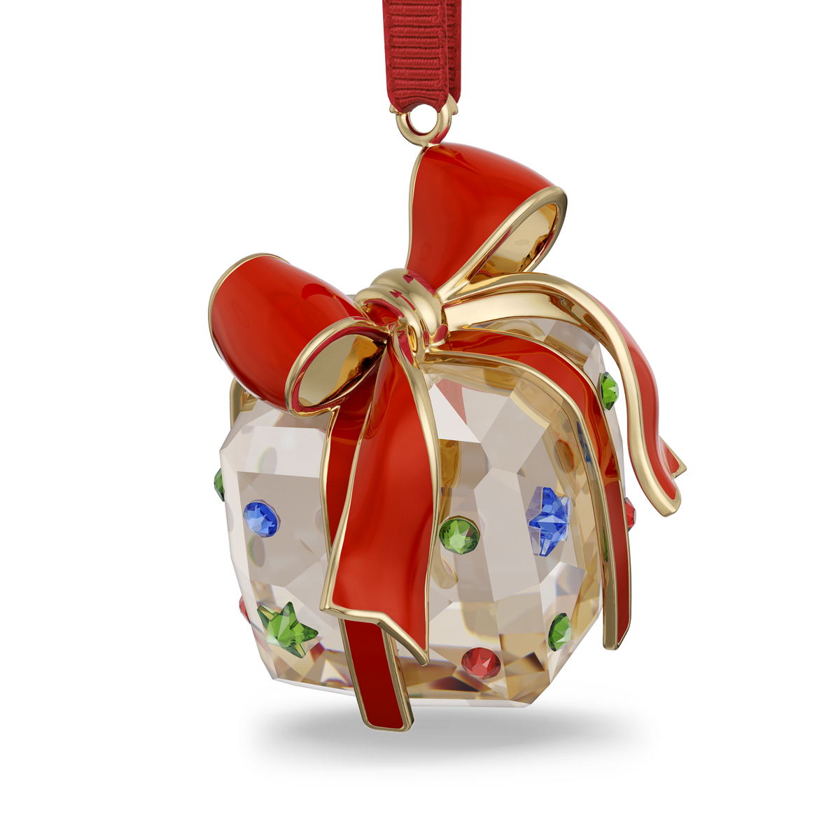 The Swarovski Holiday Cheers Gift Ornament by Swarovski features a crystal design in the shape of a gift box, embellished with multicolored gems and crowned with a radiant red and gold bow. Suspended from a red ribbon, this exquisite ornament brings sparkling charm and festive elegance to any holiday tree.