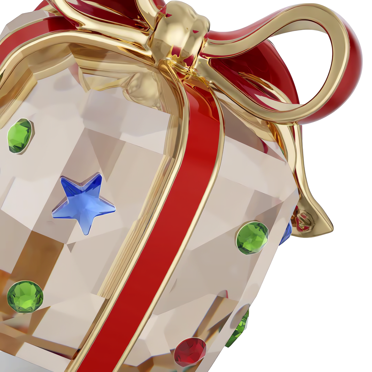 A close-up of the Swarovski Holiday Cheers Gift Ornament, expertly crafted by Swarovski, featuring a faceted crystal gift box embellished with green crystals and a blue star, topped with a shiny gold and red ribbon bow—perfect for bringing elegance to your festive tree.