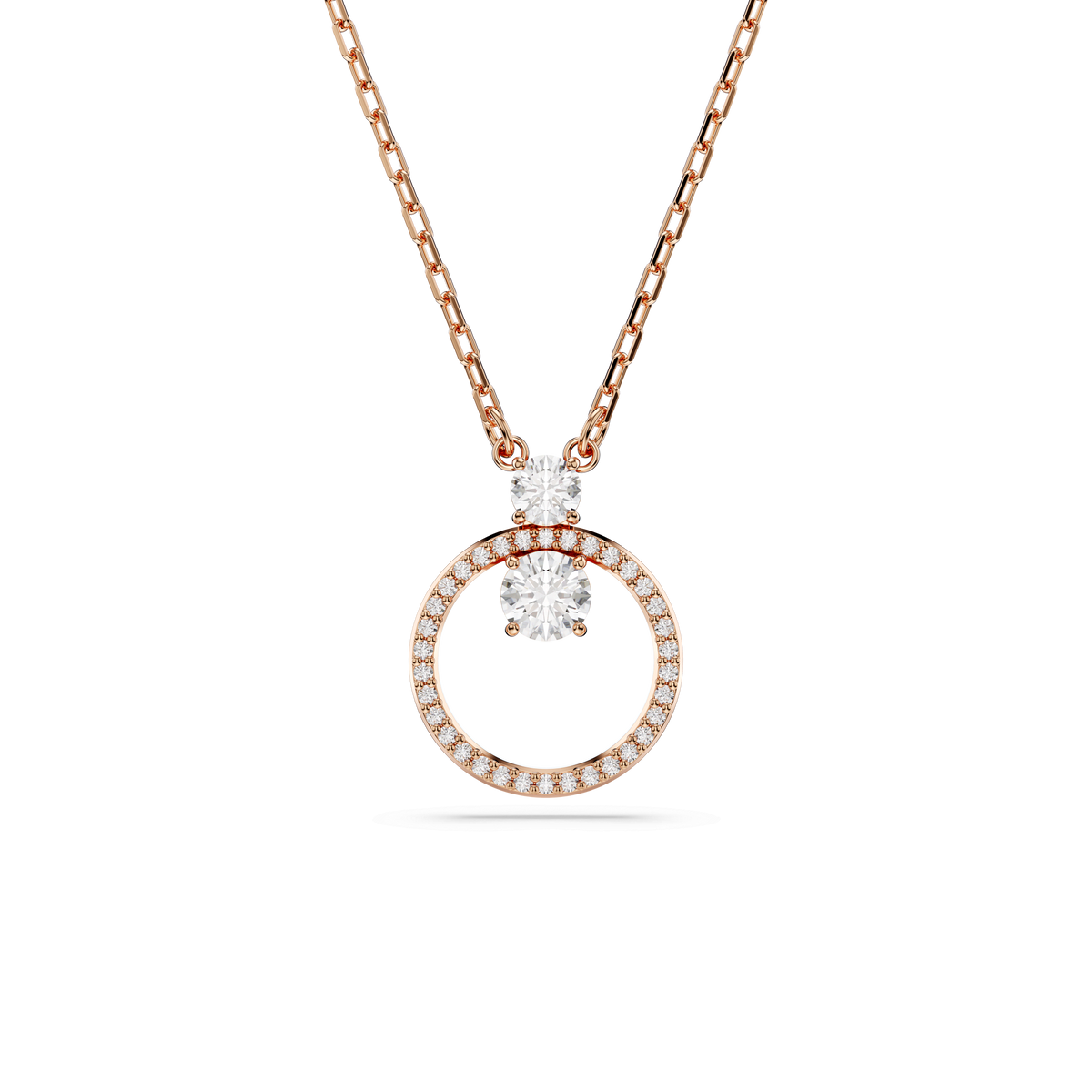 Introducing the Swarovski Constella pendant: a breathtaking round-cut necklace in white, featuring a circular pavé pendant adorned with sparkling Swarovski Zirconia and three larger stones above the circle, all gracefully suspended from a fine 18K rose gold finish chain against a white background.
