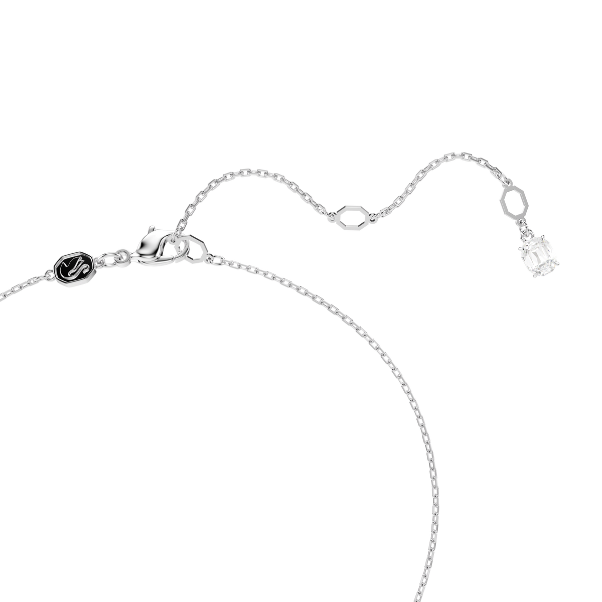 A delicate silver chain necklace by Swarovski, finished with a lobster clasp and adorned with the elegant Hyperbola pendant featuring mixed cuts in white and a mixed metal finish. The necklace includes a small black circular charm and is accented with a rectangular Swarovski Zirconia gemstone at the end of the adjustable extension.