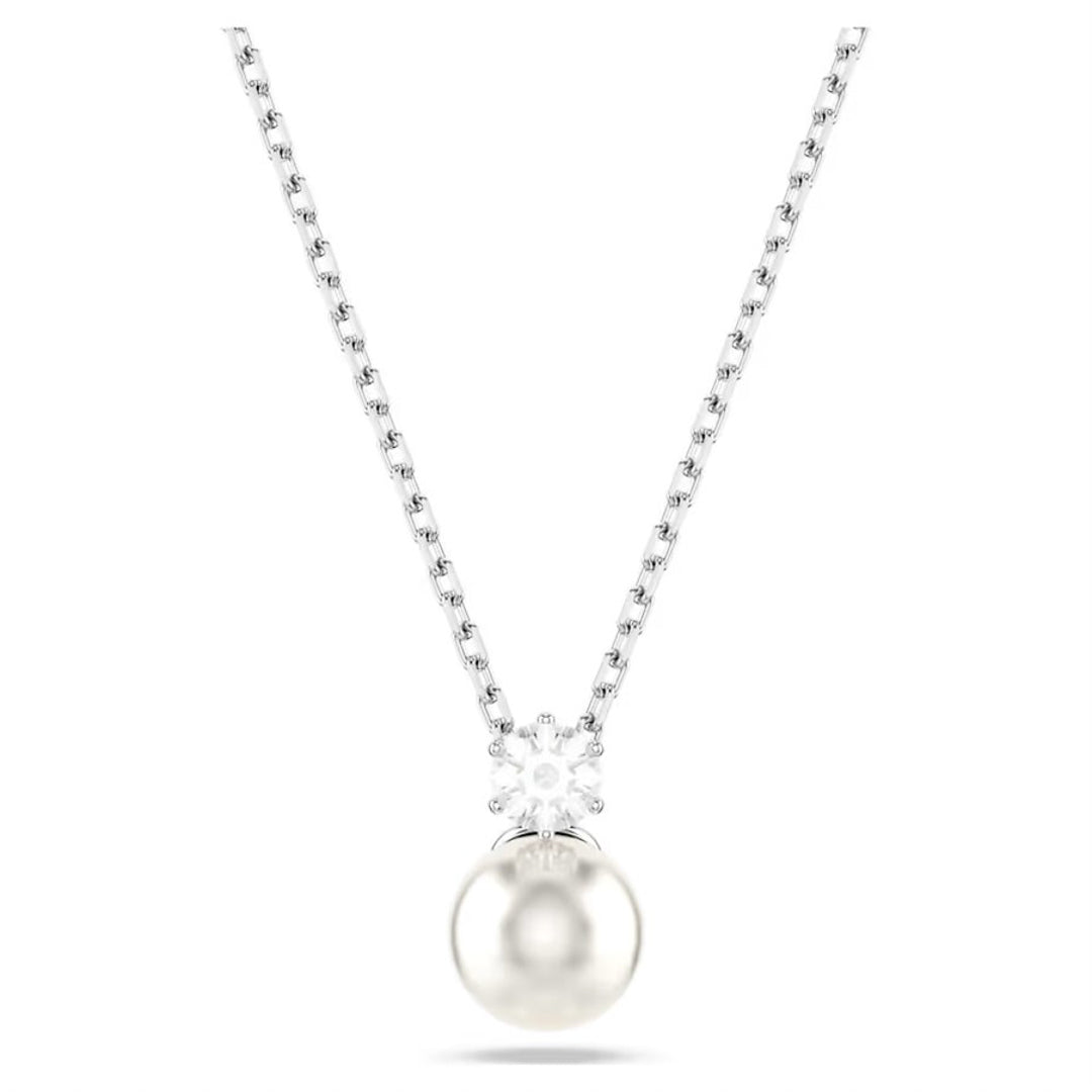 The Swarovski Matrix Crystal Pearl Necklace Pendant by Swarovski boasts a rhodium-plated design with a round pearl pendant, embellished with a cluster of white crystals that enhance the elegance of this exquisite jewelry piece. It is showcased beautifully against a plain white background.