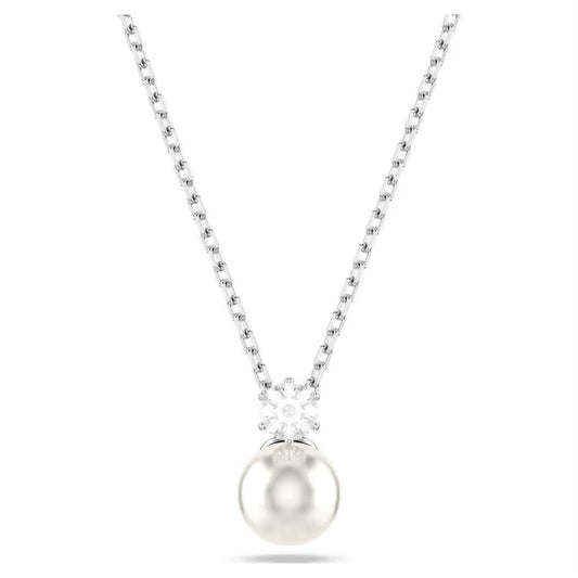 The Swarovski Matrix Crystal Pearl Necklace Pendant by Swarovski boasts a rhodium-plated design with a round pearl pendant, embellished with a cluster of white crystals that enhance the elegance of this exquisite jewelry piece. It is showcased beautifully against a plain white background.