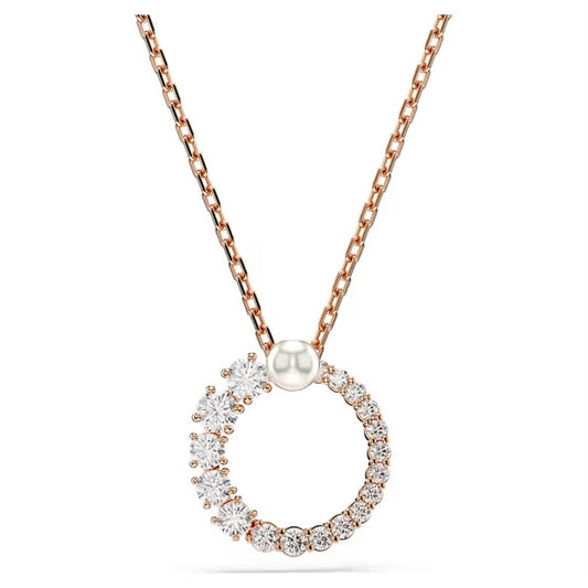 Discover the Swarovski Matrix Crystal Pearl Necklace Pendant, a refined piece from Swarovski adorned with sparkling crystals in varying sizes. This rose gold necklace features a circular pendant and is paired with a delicate, thin chain that enhances its elegant design.