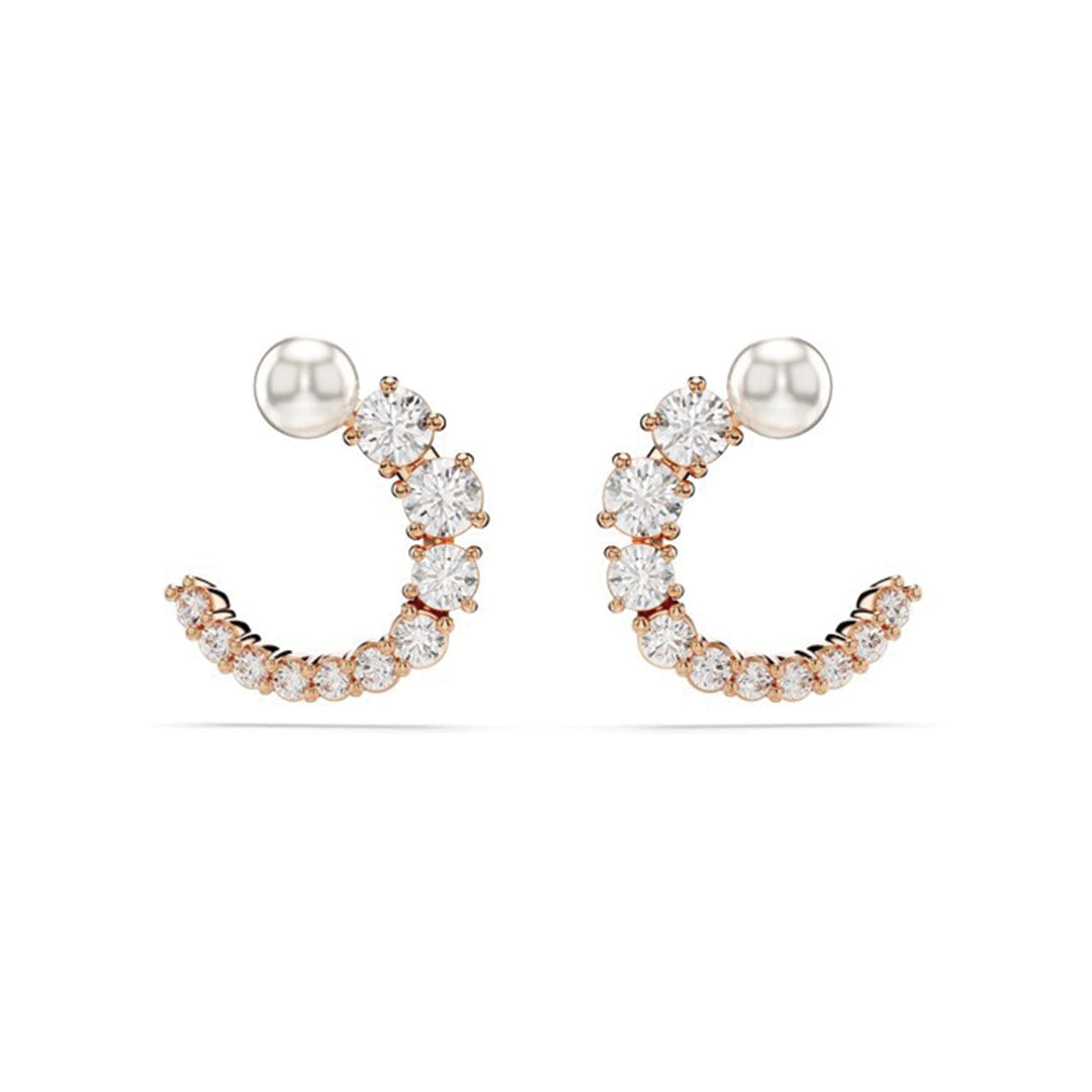 Introducing the Swarovski Matrix Crystal Pearl Circular Stud Earrings: A pair of elegant hoop earrings featuring a gold base, embellished with sparkling round diamonds that gradually increase in size from bottom to top. Each earring is finished with a crystal pearl stud, enhancing their refined sophistication. Crafted by Swarovski.